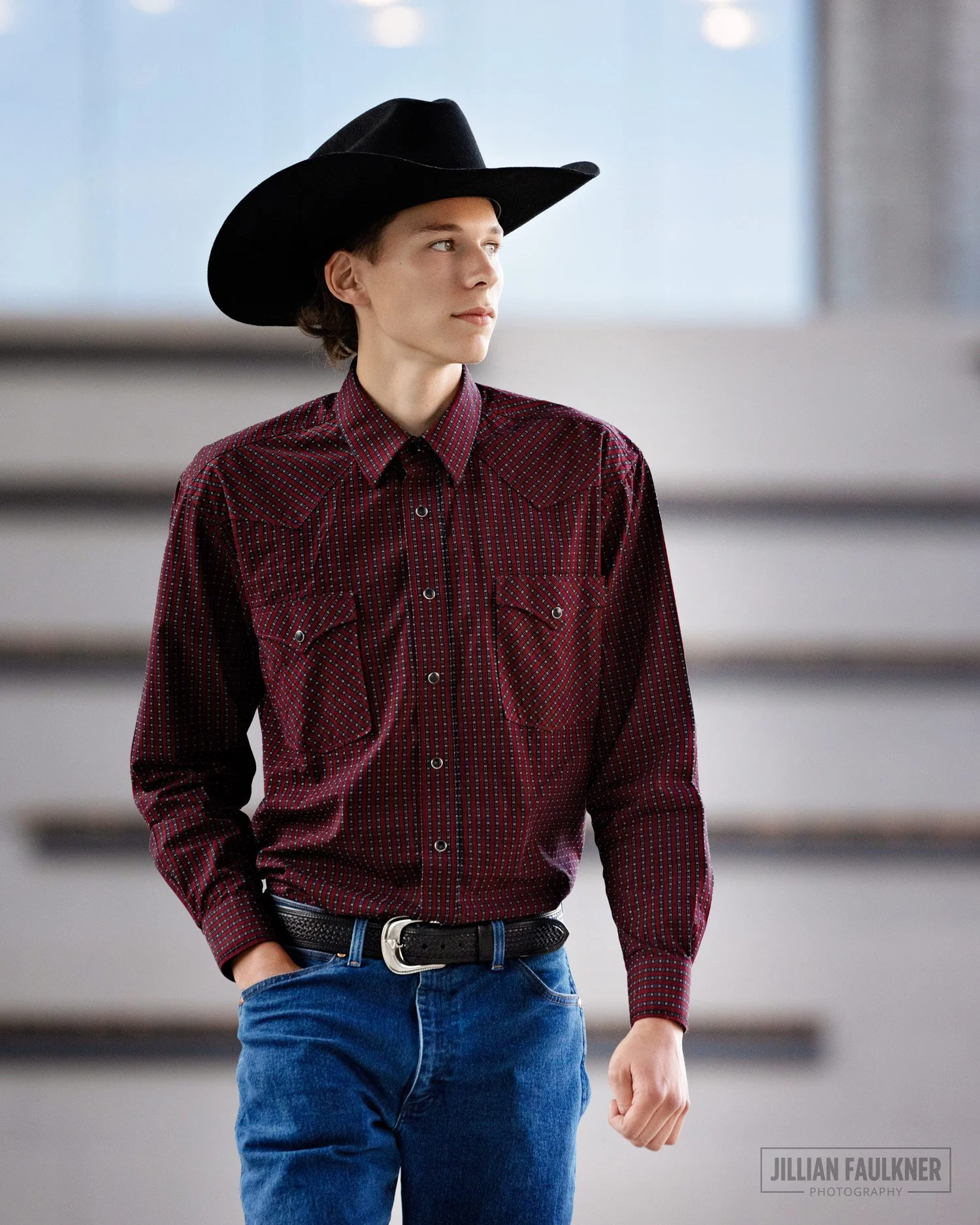graduation photo shoot at Calgary BMO Centre, photographed outdoors at sunset with male high school graduate and western theme