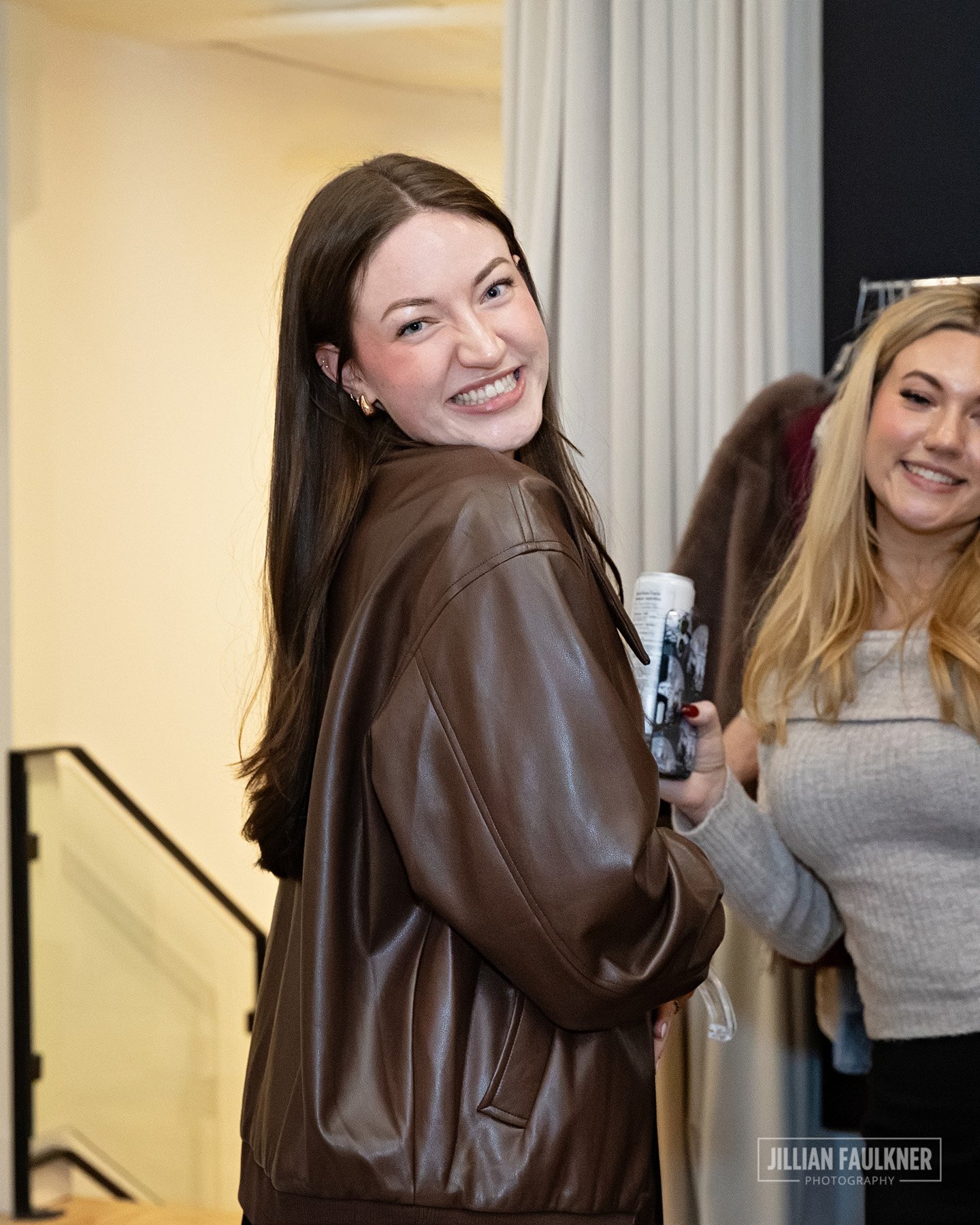 Calgary event photography of guests engaging with curated designer collection during the exclusive shopping experience