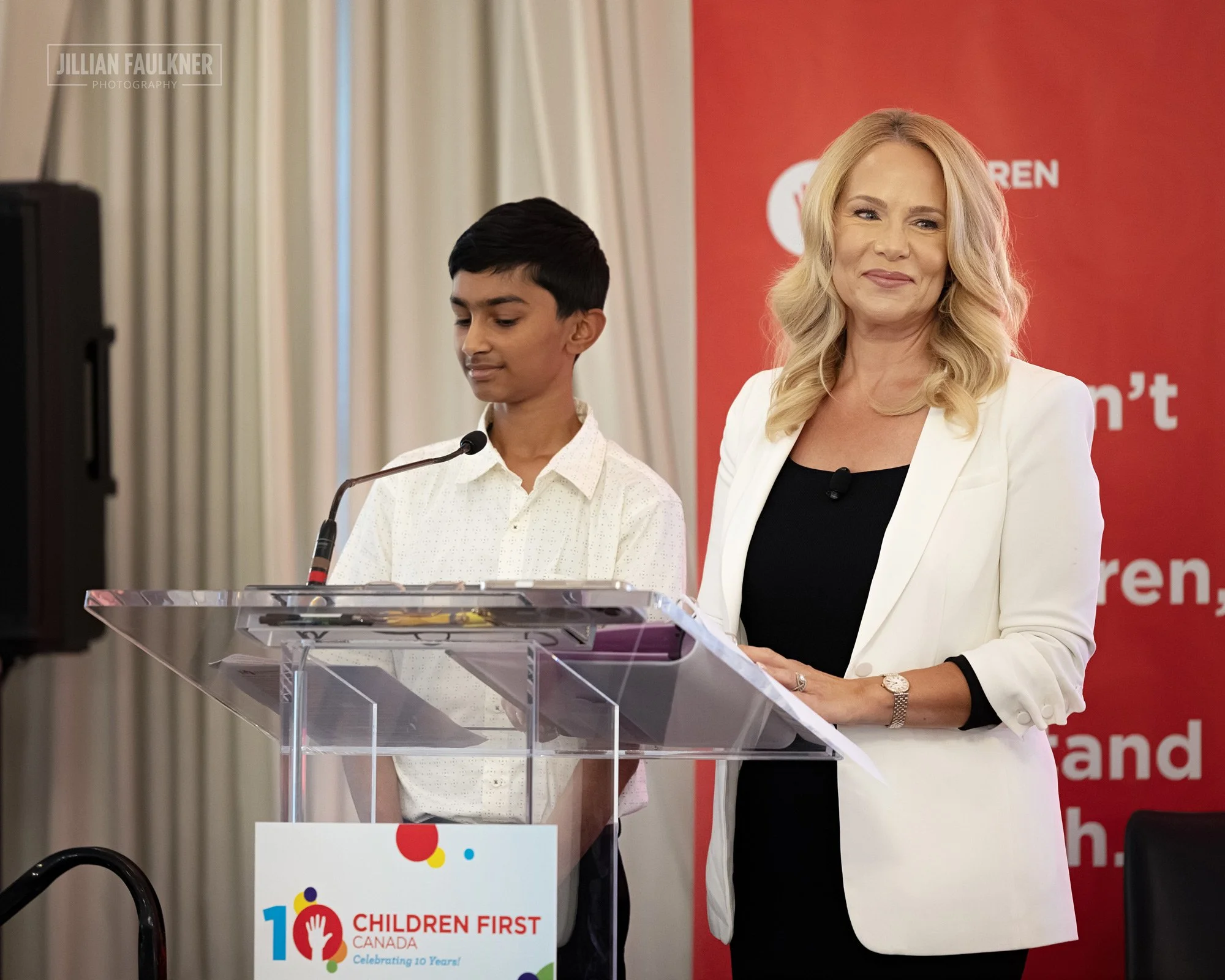 Calgary-event-photographer-capturing tow-keynote-speakers-at-corporate-10-year-anniversary-event