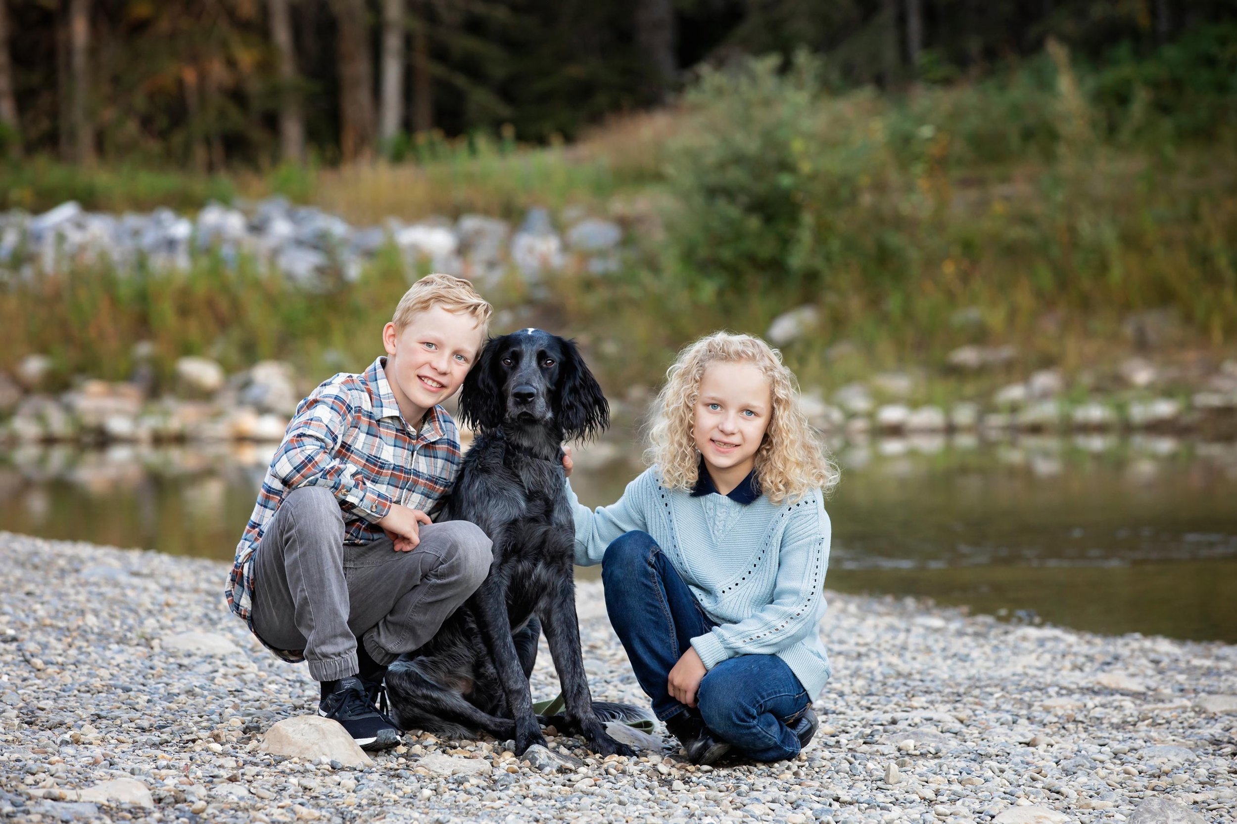 calgary fish creek park sibling photo by the water with the family dog