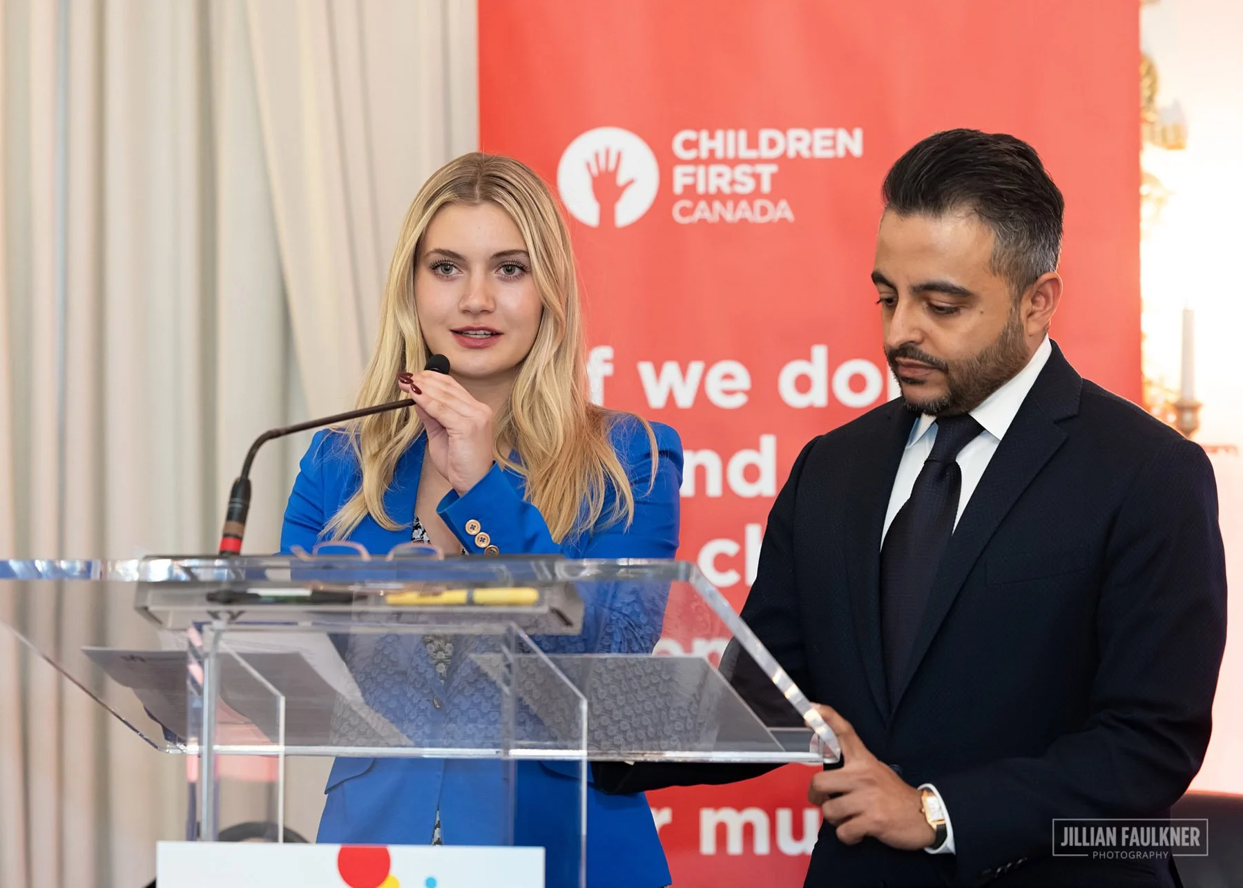 Calgary corporate event photographer documenting powerful keynote presentation at gala luncheon