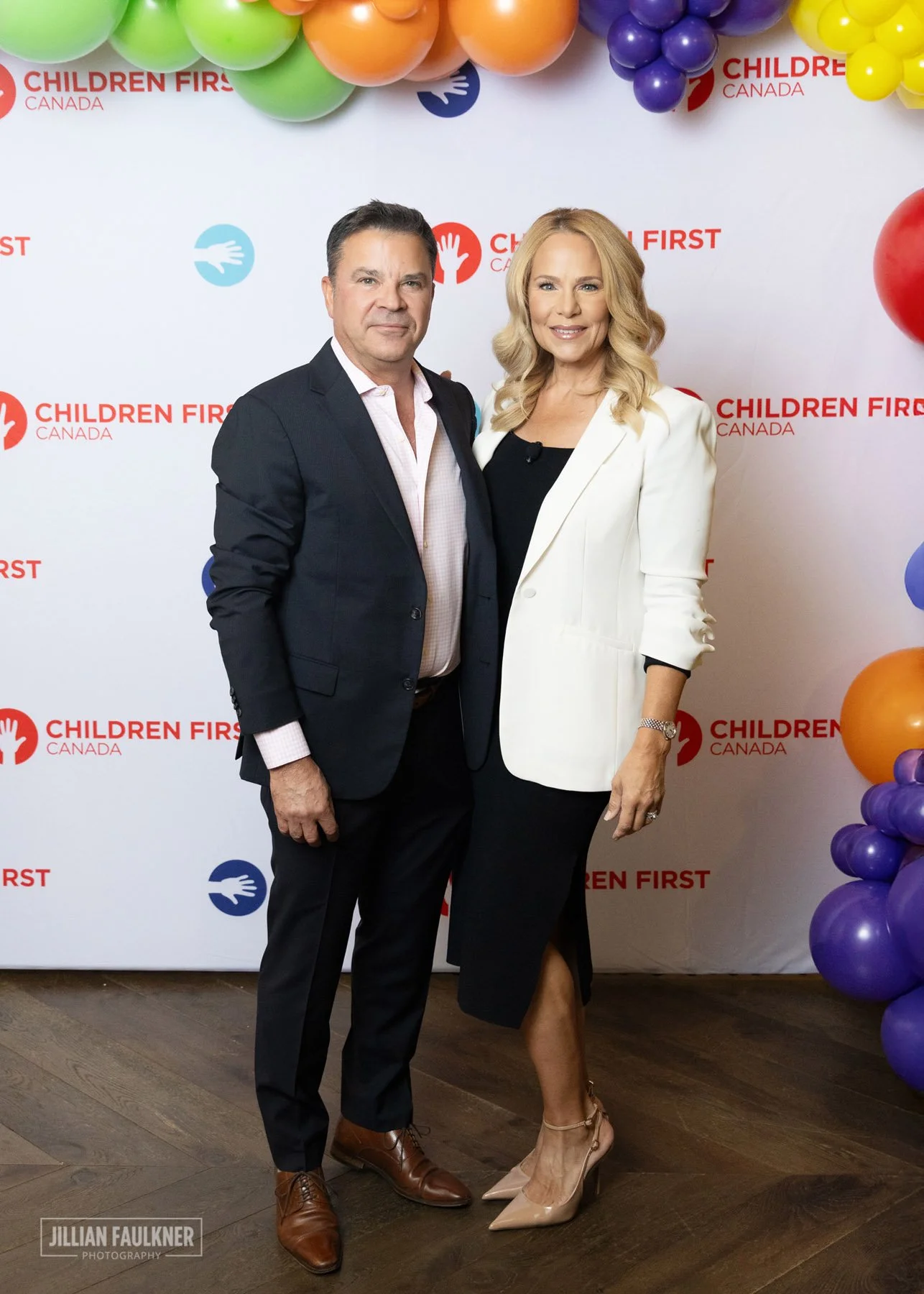 Calgary event photographer capturing VIP guest portrait at Children's First Canada step and repeat