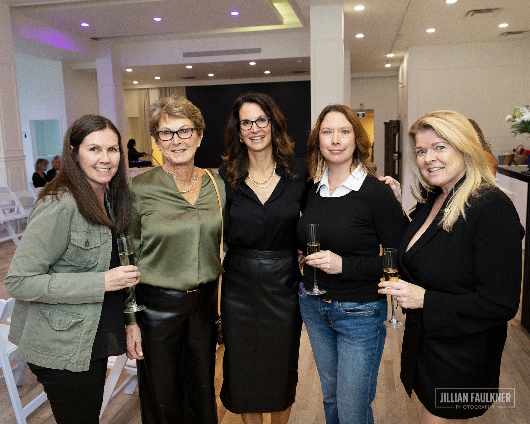 Professional Calgary Alberta reception photographer documents guests mingling and toasting at Brookline PR's luxury champagne reception Fall Fashion Show 2025