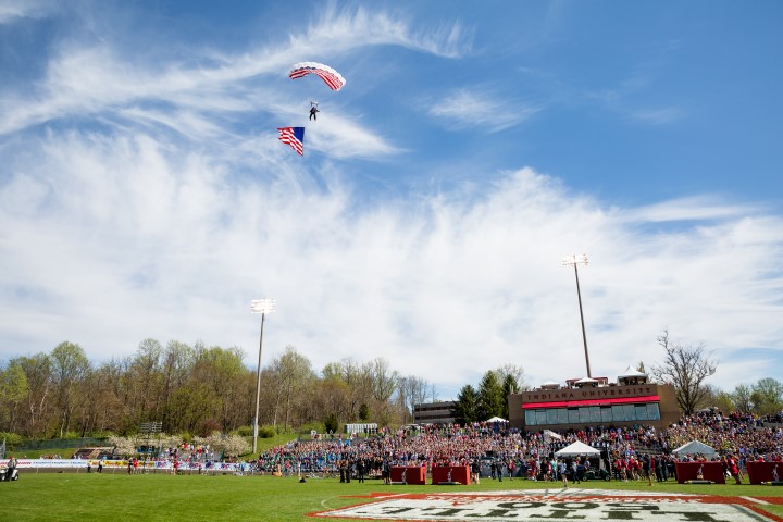 The flag soars above the stadium