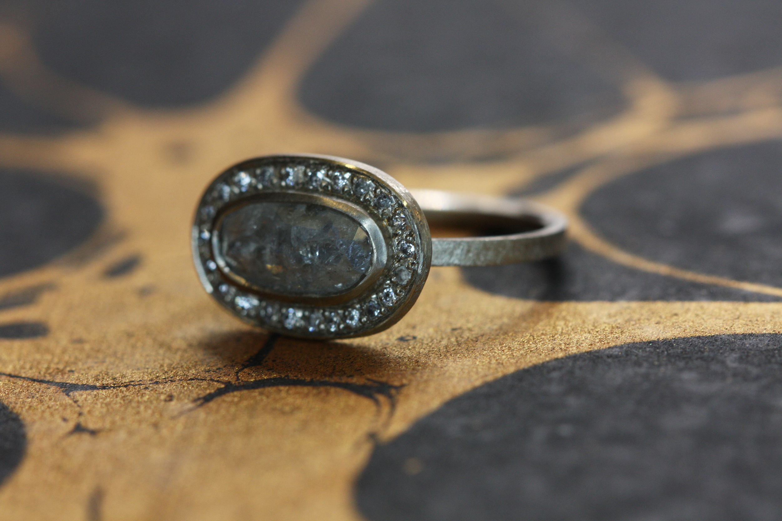 Grey Halo Ring on Marble Paper.png