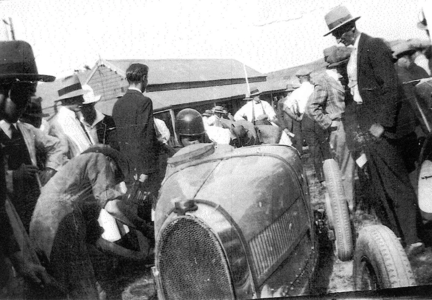 crowd-around-race-car-1927.jpg