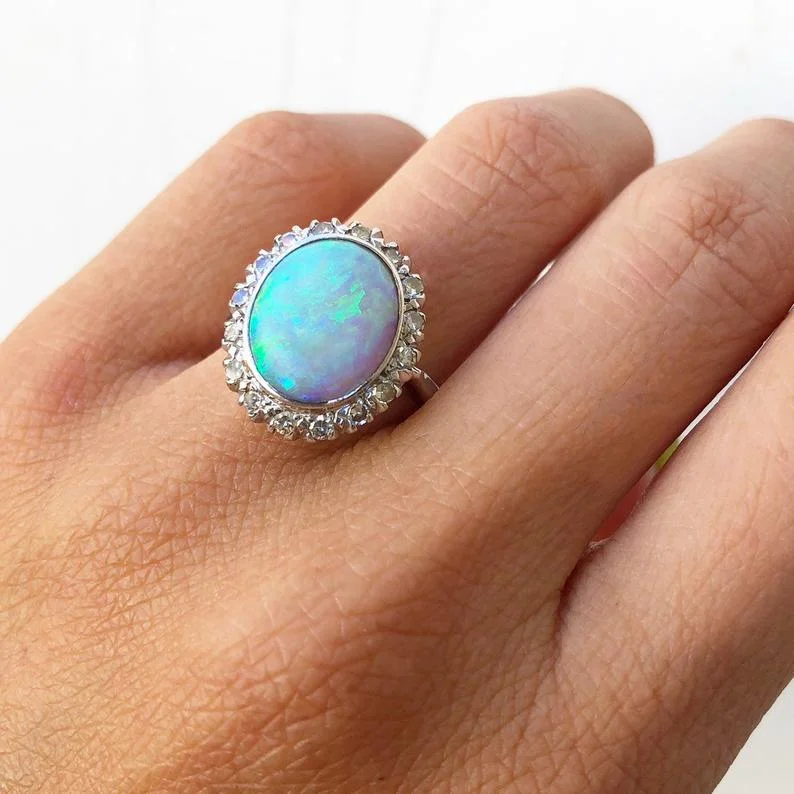 opal diamond art deco engagement ring hand