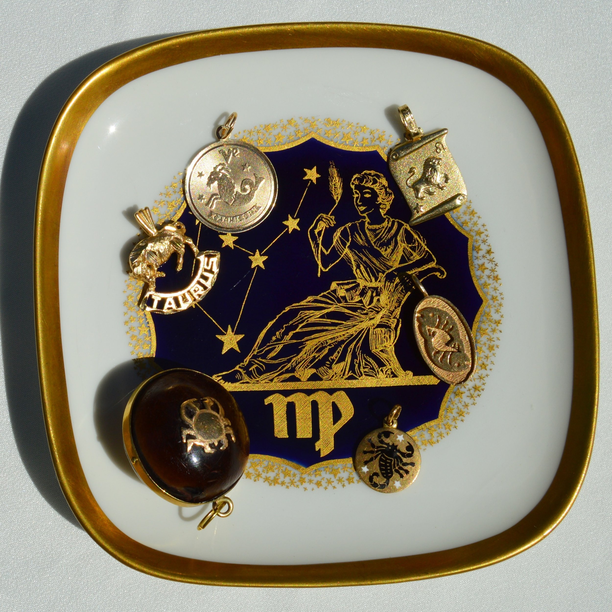 Vintage gold zodiacs &amp; midcentury porcelain German Virgo catchall dish all online (Scorpio 18K enamel &amp; 14K Leo are PC, but DM if interested!) ✨Tap post to shop or link in bio #zodiacharms #scorpio #leo #taurus #capricorn #pisces #cancer #vir