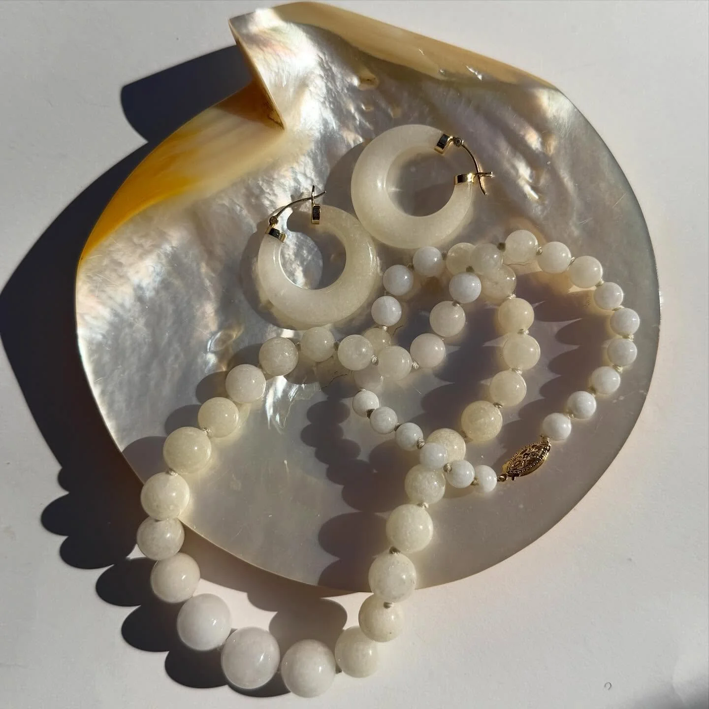 The prettiest duo! A matching set acquired together, vintage c1970s 14K gold natural untreated white jadeite jade chubby 1 1/4&rdquo; diameter hoops, $425 IG pricing or link in bio &amp; graduated silk cord knotted 18&rdquo; long necklace $455 - Not 