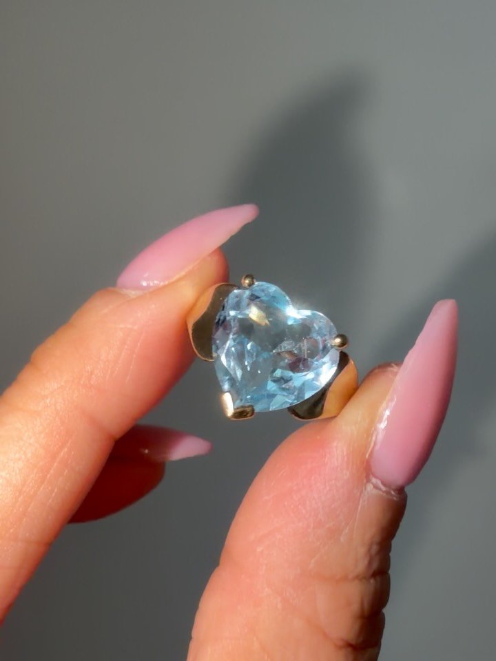 Who&rsquo;s the lucky girl snatching up this huge vintage blue topaz 10K heart cut beauty?! Size 7, easily resizable. In excellent condition. Ring weighs 4.06 grams. Topaz measures 12x14mm. DM to claim at 625 shipped! Not online yet. Zelle Venmo PayP