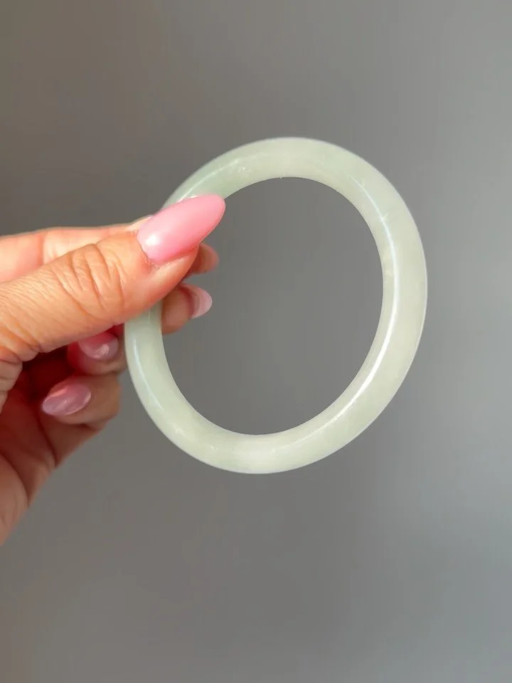 Another vintage untreated jadeite jade donut bangle! This one is 57mm, which best fits a 7.5-8.5&rdquo; wrist. But I think 7&rdquo; wrist would be fine too. My wrist is 5.5&rdquo; for comparison. 10mm wide. DM to claim at 380 shipped pre list pricing