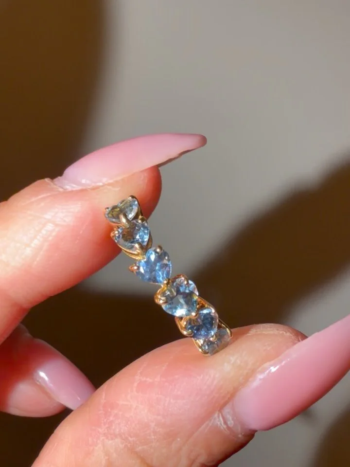 The prettiest 18K blue topaz heart cut half eternity 🩵🩵🩵 Size 5.25, resizable if needed. In excellent pristine condition. DM to claim 750 shipped! Zelle Venmo PayPal FF. Intl ship fees vary