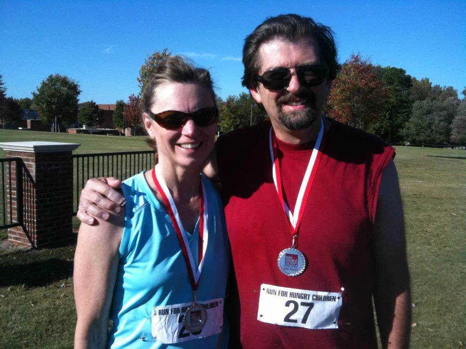 Kathy, Bill running medals.jpg