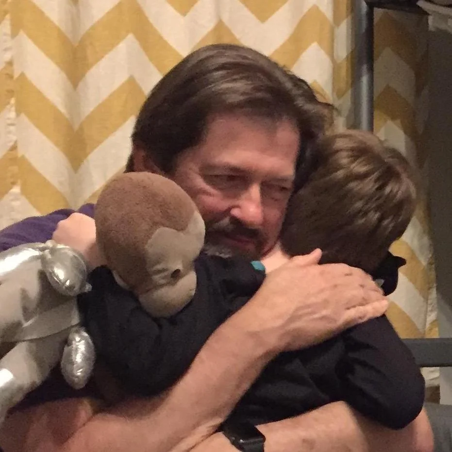 Bill hugging Jim.jpg