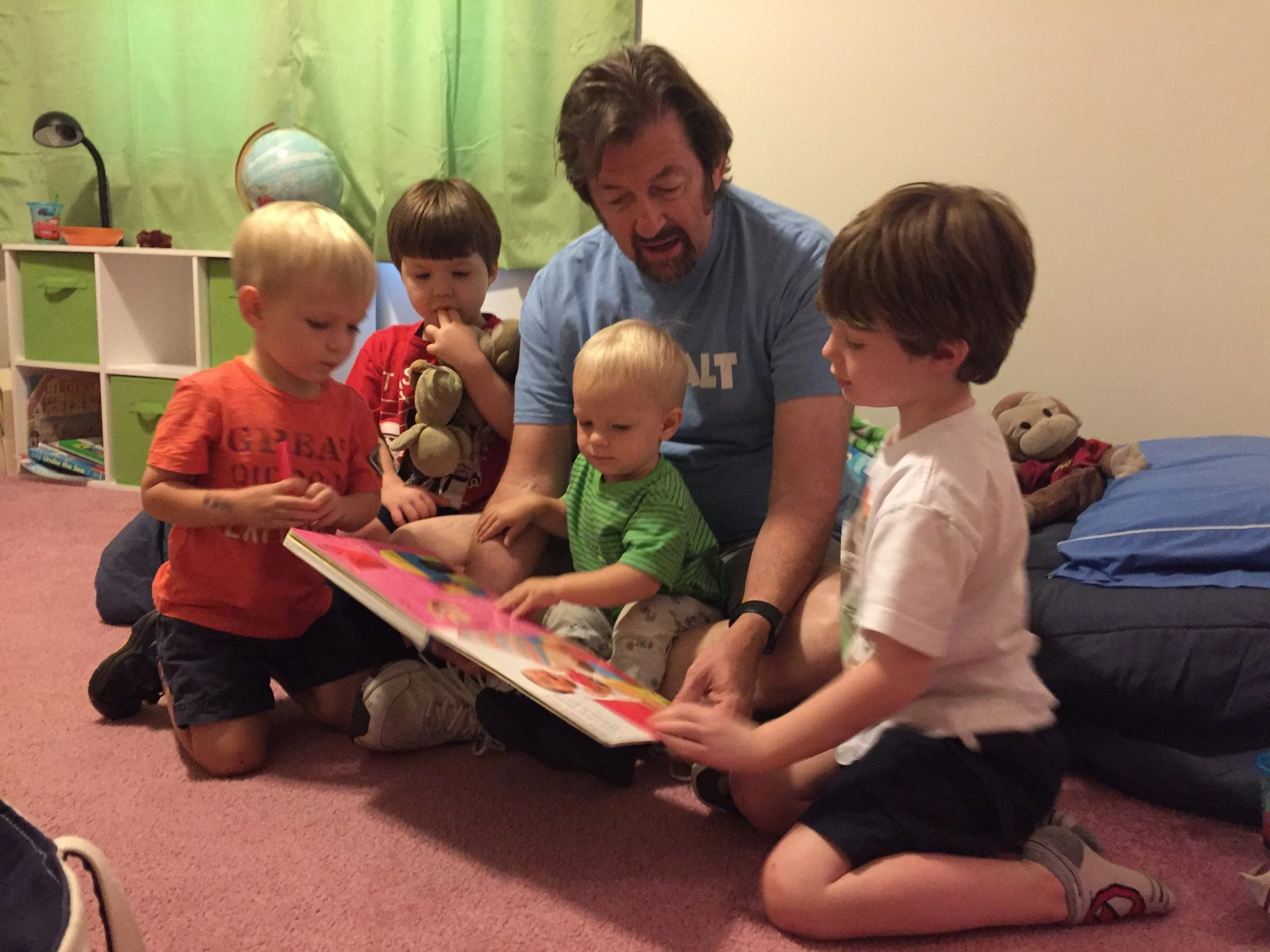 Bill reading to grandsons.jpeg