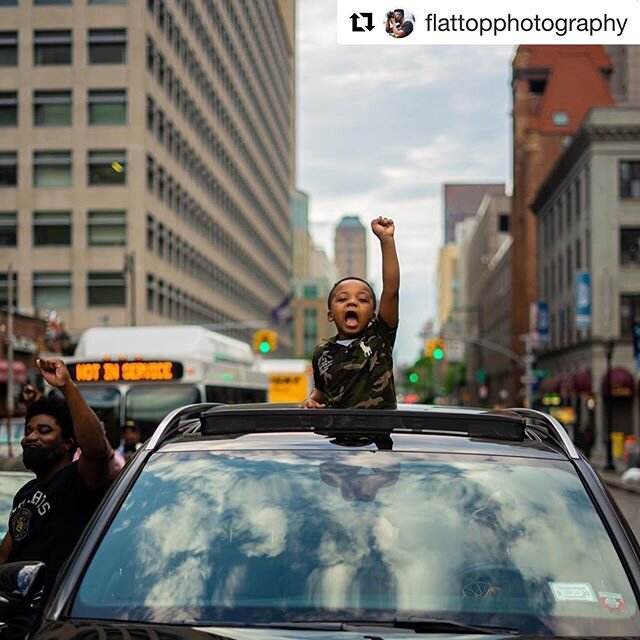 #Repost @flattopphotography with @get_repost
・・・
America, y&rsquo;all hear us now? We&rsquo;re black and we&rsquo;re proud ✊🏾🖤
.⠀
Marching yesterday with hundreds of people in downtown Brooklyn, I saw this young kid launch through his sunroof to jo