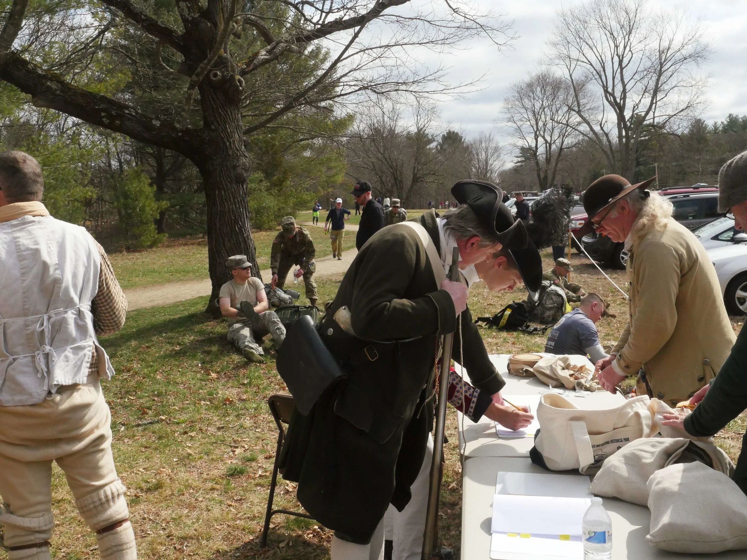 Lincoln, MA - April 14th, 2018 - Hannes and Gavin Klein check in for the Battles of Lexington and Concord. Hannes Klein says that the Battle of Lexington is iconic in the reenactment scene saying, “this is like almost one of the battles you have to have. You have to have fought on the battle green in Lexington.” This year the reenactments fell on the same day as a marathon being run in the Minuteman National Park.