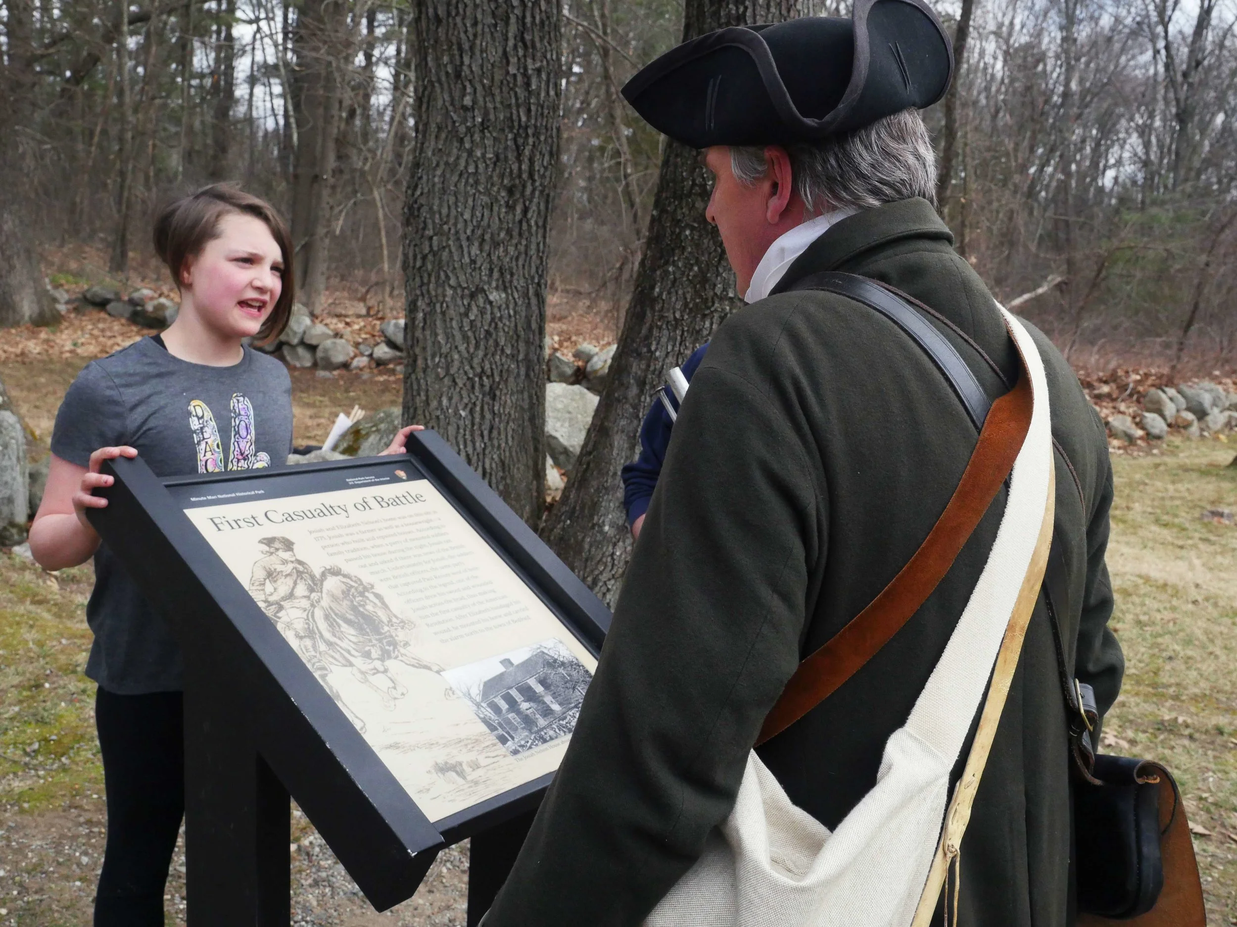 Lincoln, MA - April 14th, 2018 - A young girl asks Battle of Lexington and Concord reenactor Hannes Klein questions about the Revolutionary War on his way to the battles. Klein loves the Revolutionary War because, “I always say ‘because of these guys with their sticks and their round balls we can have a free discussion, we can speak our minds and we’re not being persecuted because of it’ … and that to me is very important that they realized that.”