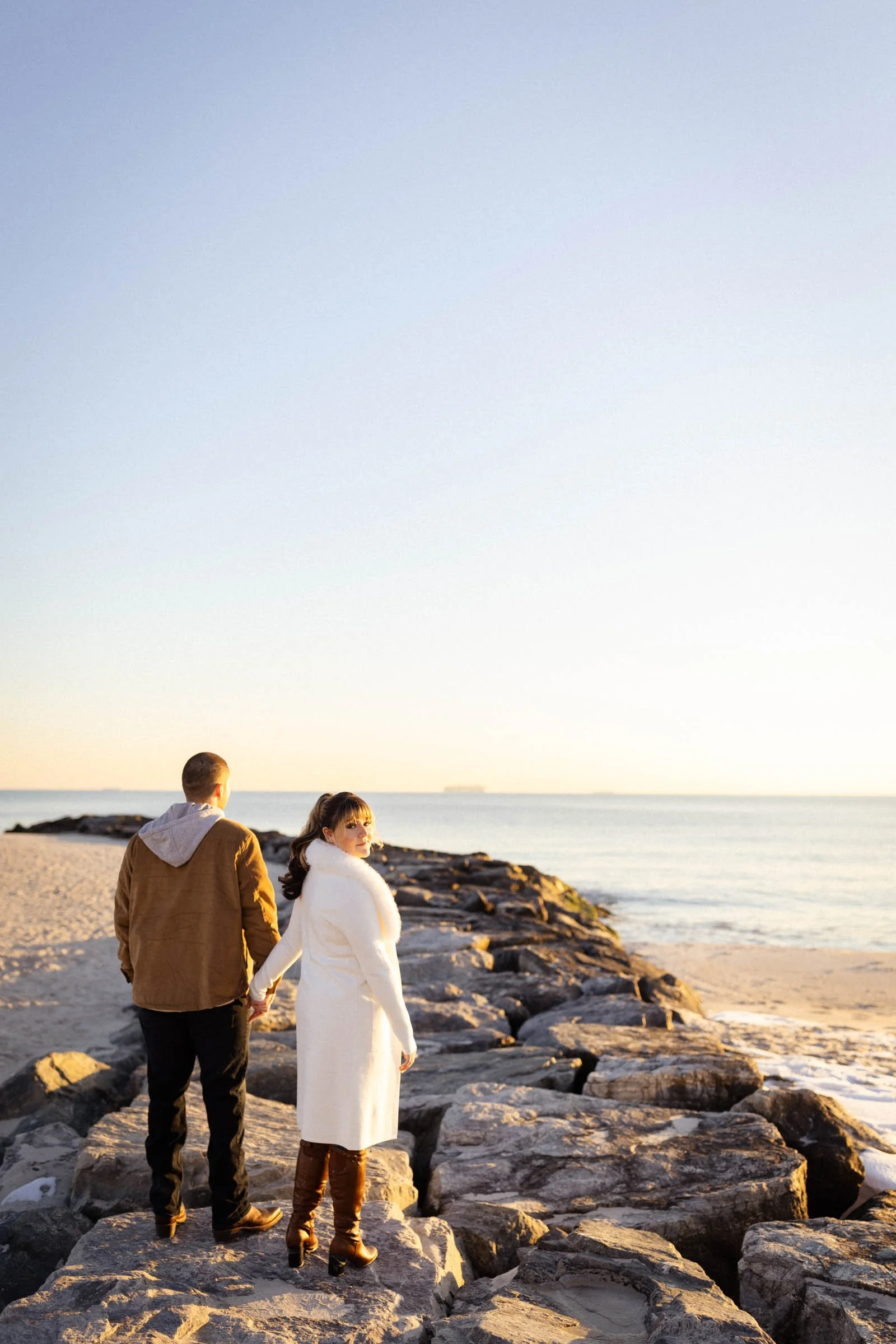  Couple standing on breaker at Long Beach, NY. 