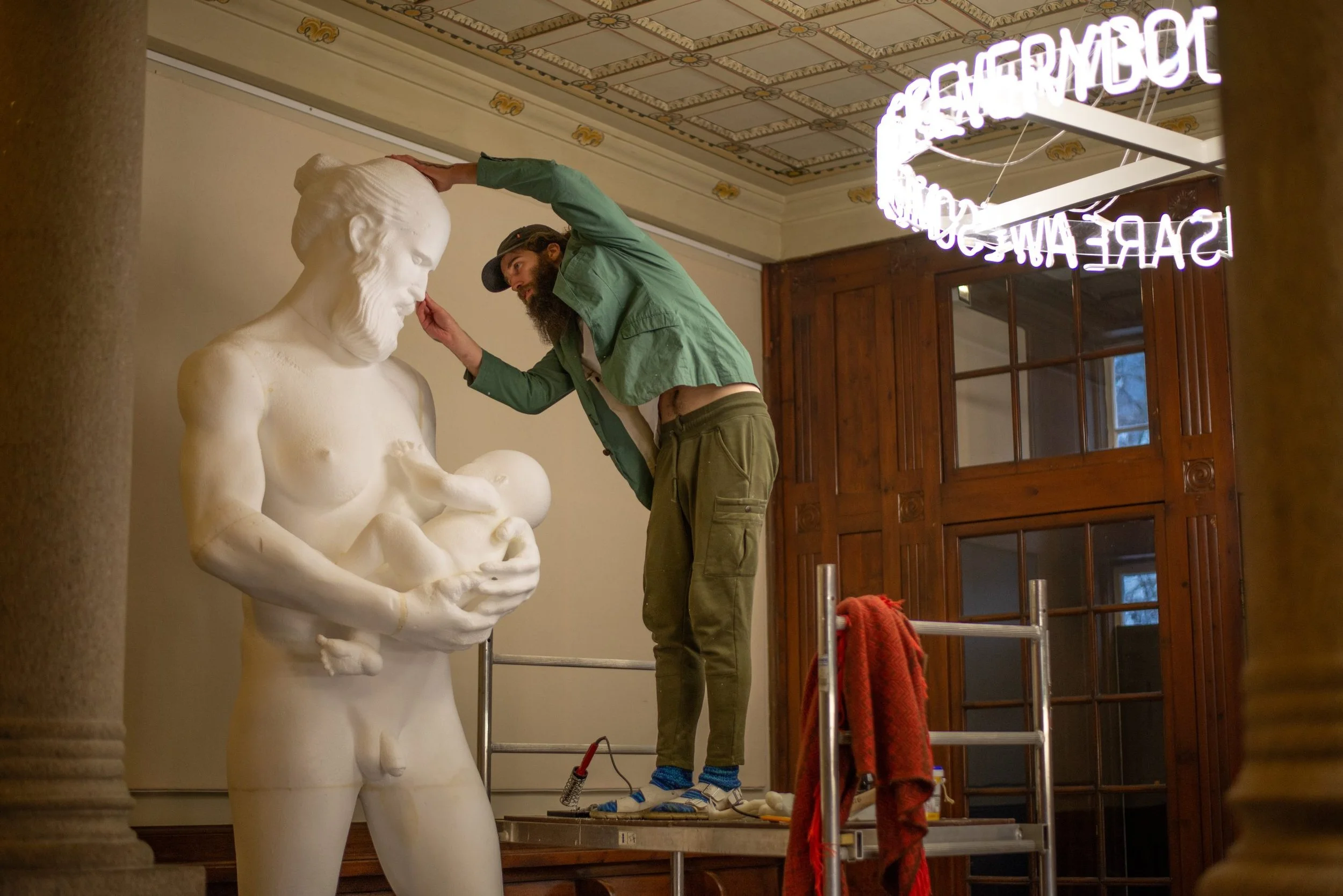  Aske working on his sculpture “AGAPE” 