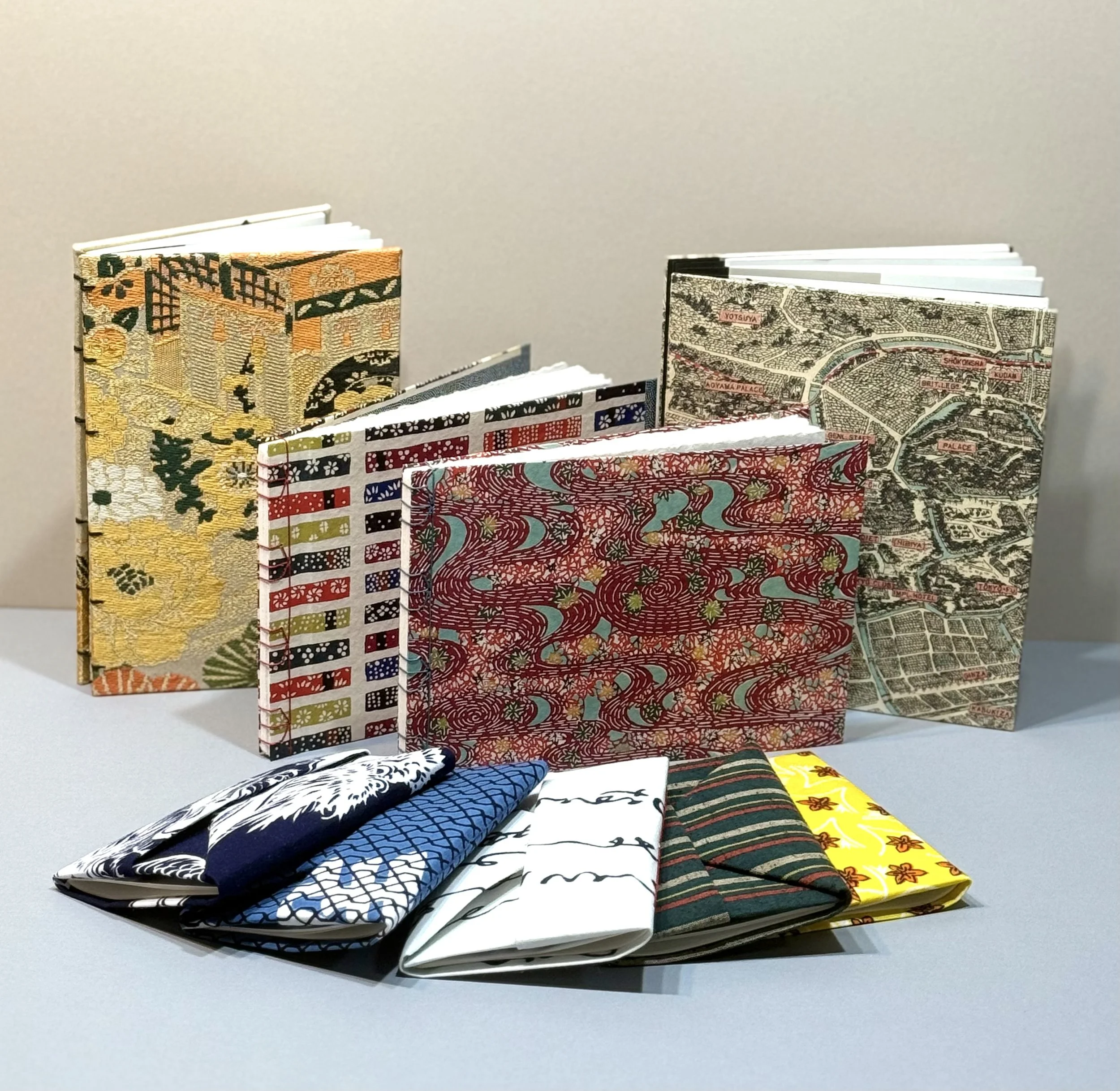 Assorted blank journals and travel folios