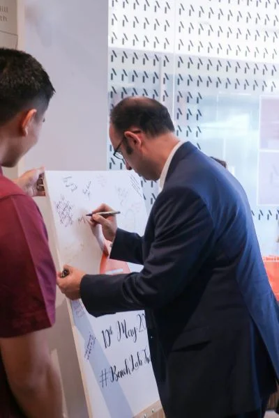 Here’s the Turkish Ambassador, His Excellency Mehmet Suat Akgün, signing our guestbook.