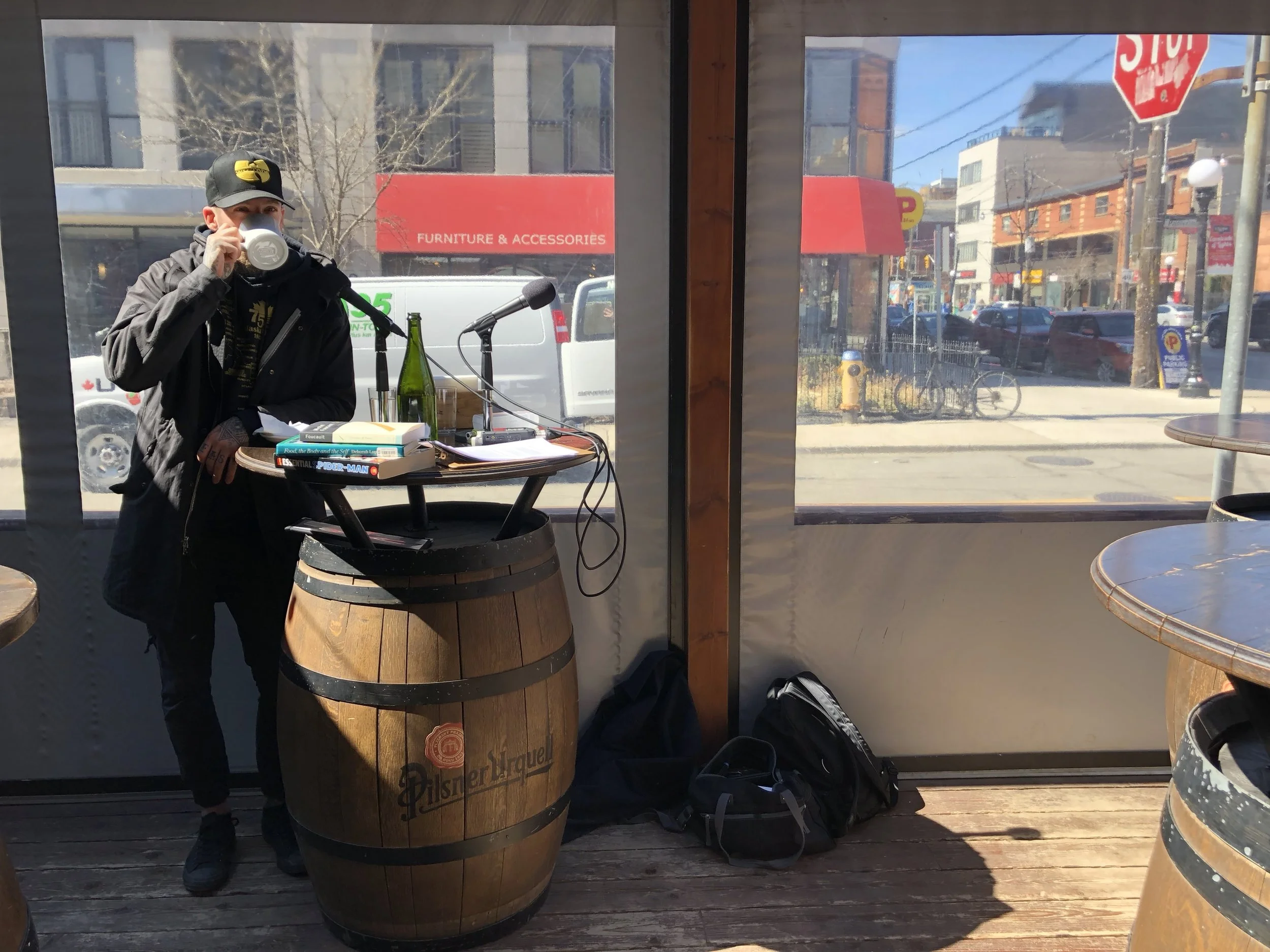 Our podcast studio on the Bar Raval patio. Robin sipping his coffee as we get set to record.
