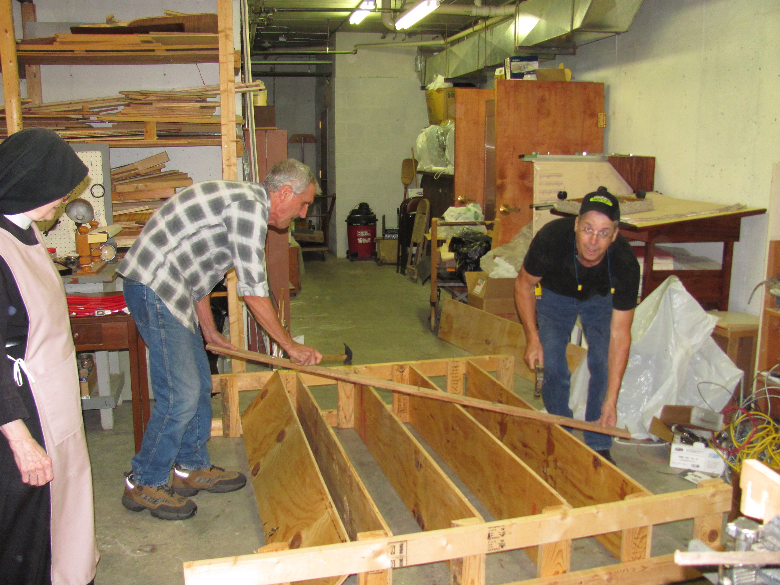 Dwayne and Mike volunteer to build shelving for the Nuns