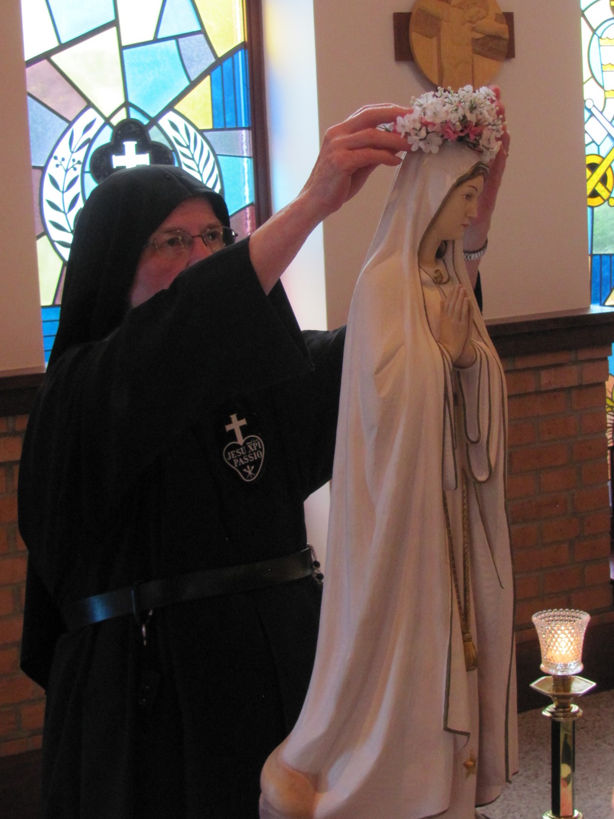  Sr. Mary Agnes crowns Our Lady of Fatima near the sanctuary in the chapel 