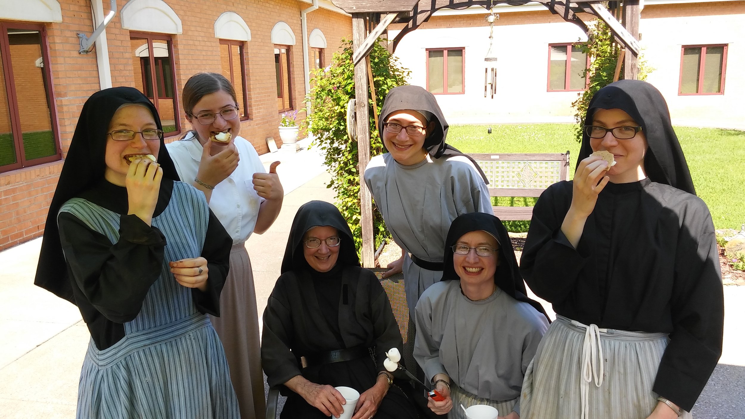  Sr. Frances Marie, Theresa, Sr. Mary Veronica, Sr. Lucia Marie, Sr. Cecilia Maria, and Sr. Maria Faustina enjoying some 4th of July s’mores 