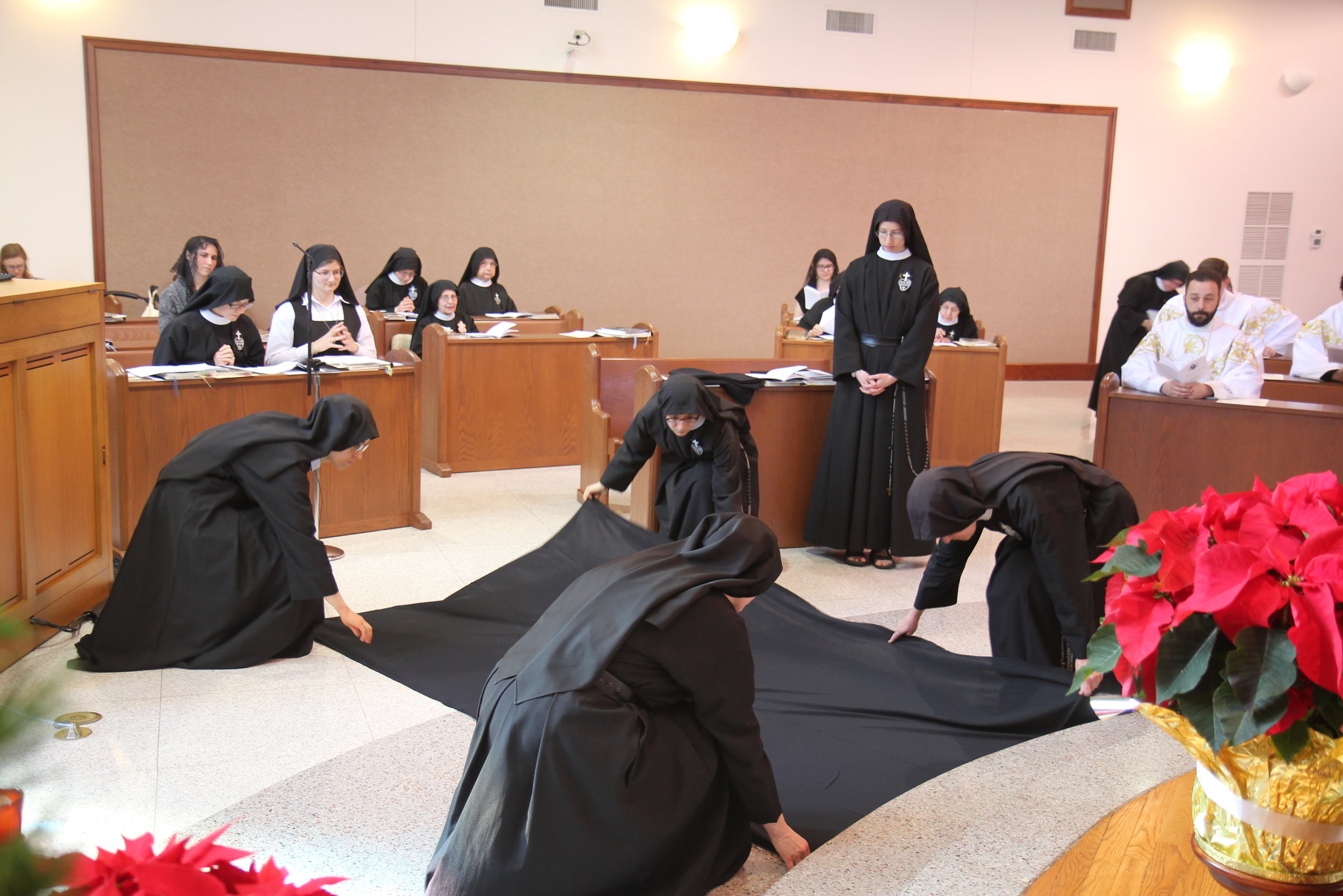  Sister Cecilia Maria prepares to lie prostrate beneath a black pall, symbolizing her death to worldliness 