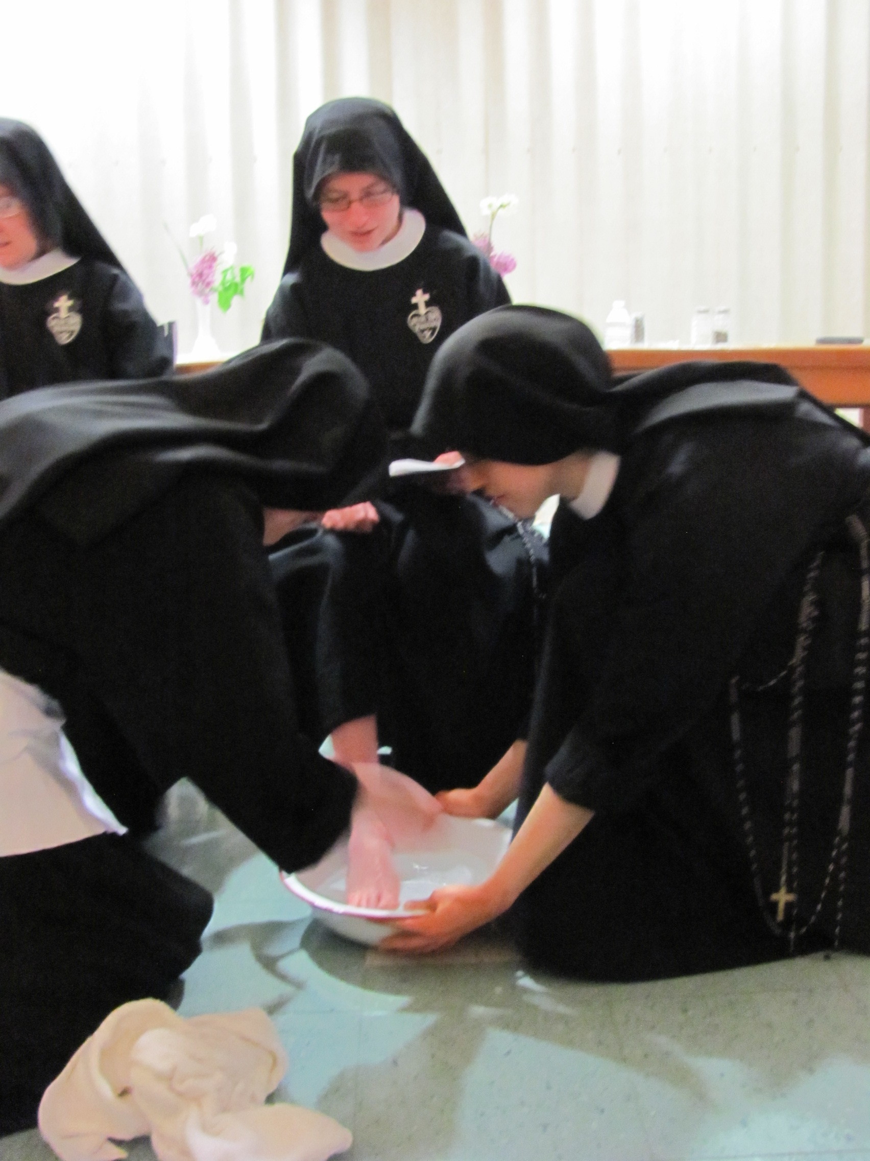  Mother John Mary washes the feet of 12 nuns during the Mandatum. 