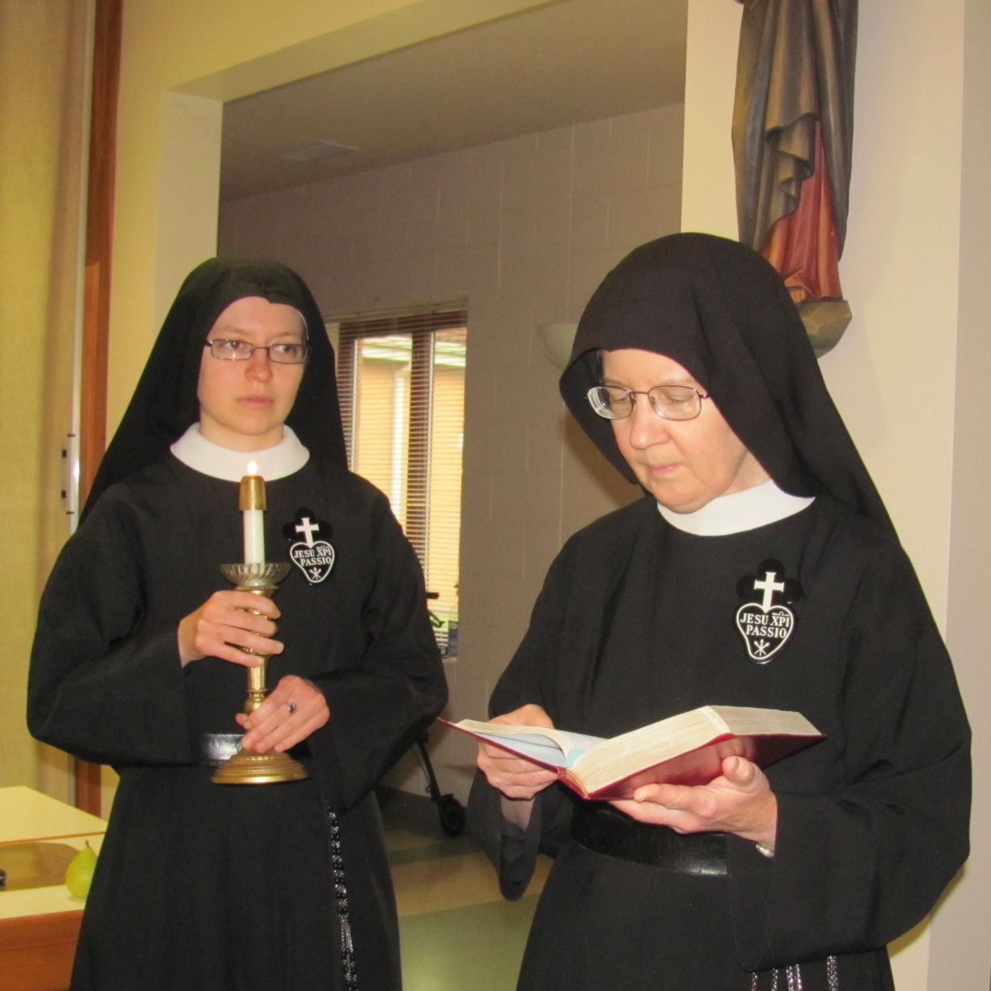  Sr. Mary Veronica reads the gospel during our Mandatum ceremony. 