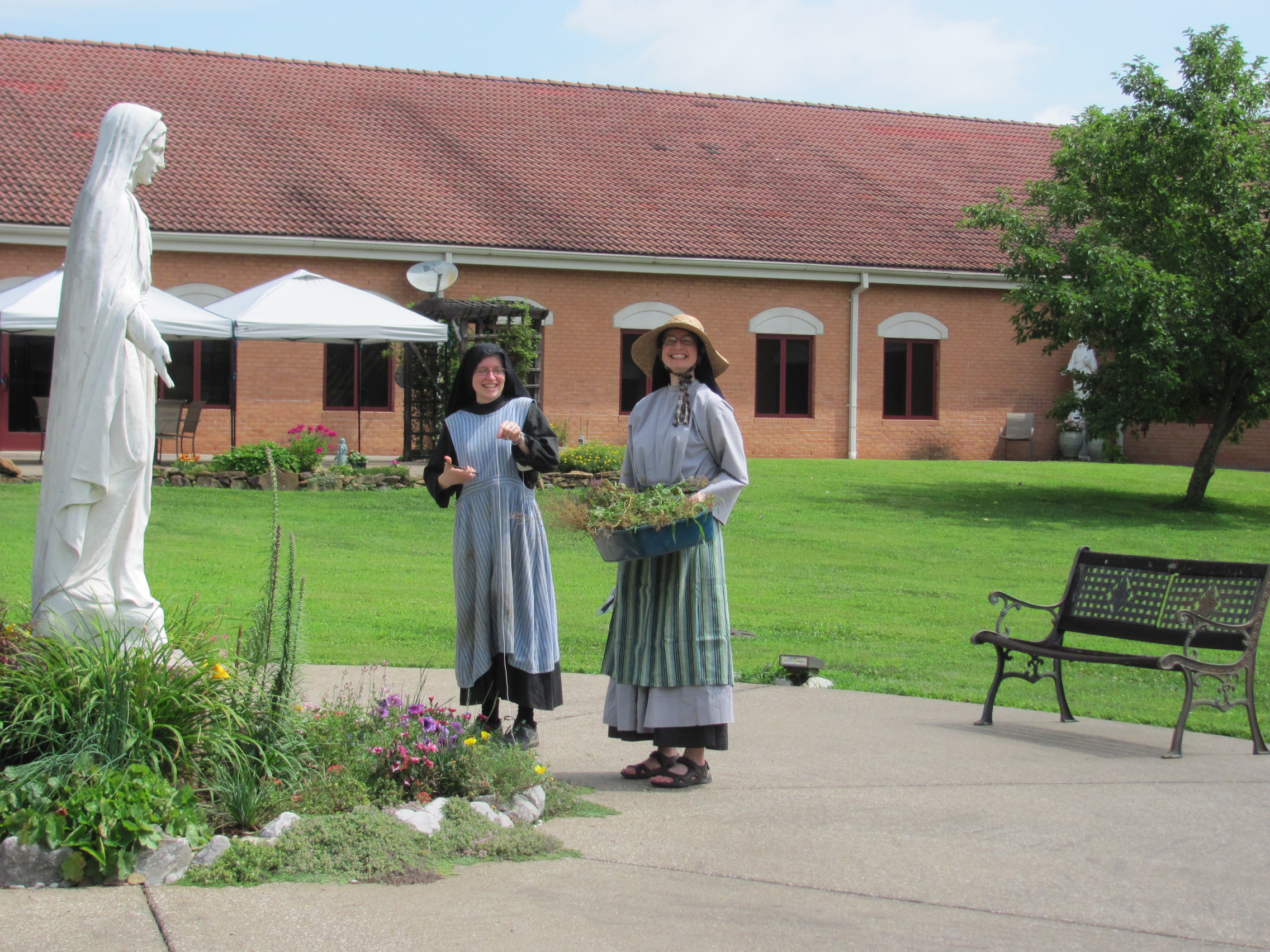 Sr. Frances Marie and Sr. Cecilia Maria gardening in the monastery courtyard. 