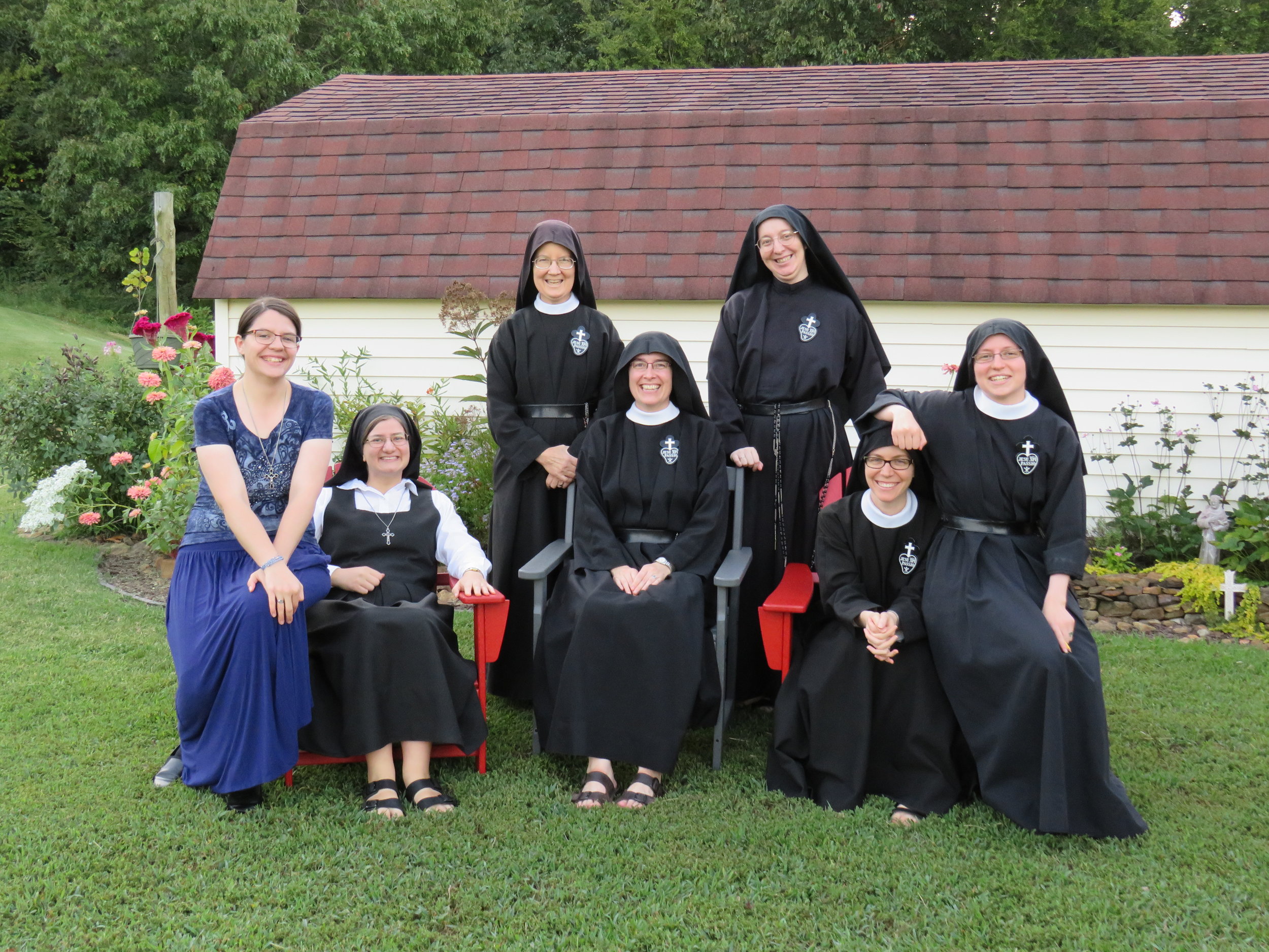  A (mostly) normal photo - aspirant Kathryn, postulant Theresa, Sr. Mary Veronica, Mother John Mary, Sr. Daniela, Sr. Maria Faustina the Long-Suffering Arm Rest, and Sr. Frances Marie. 