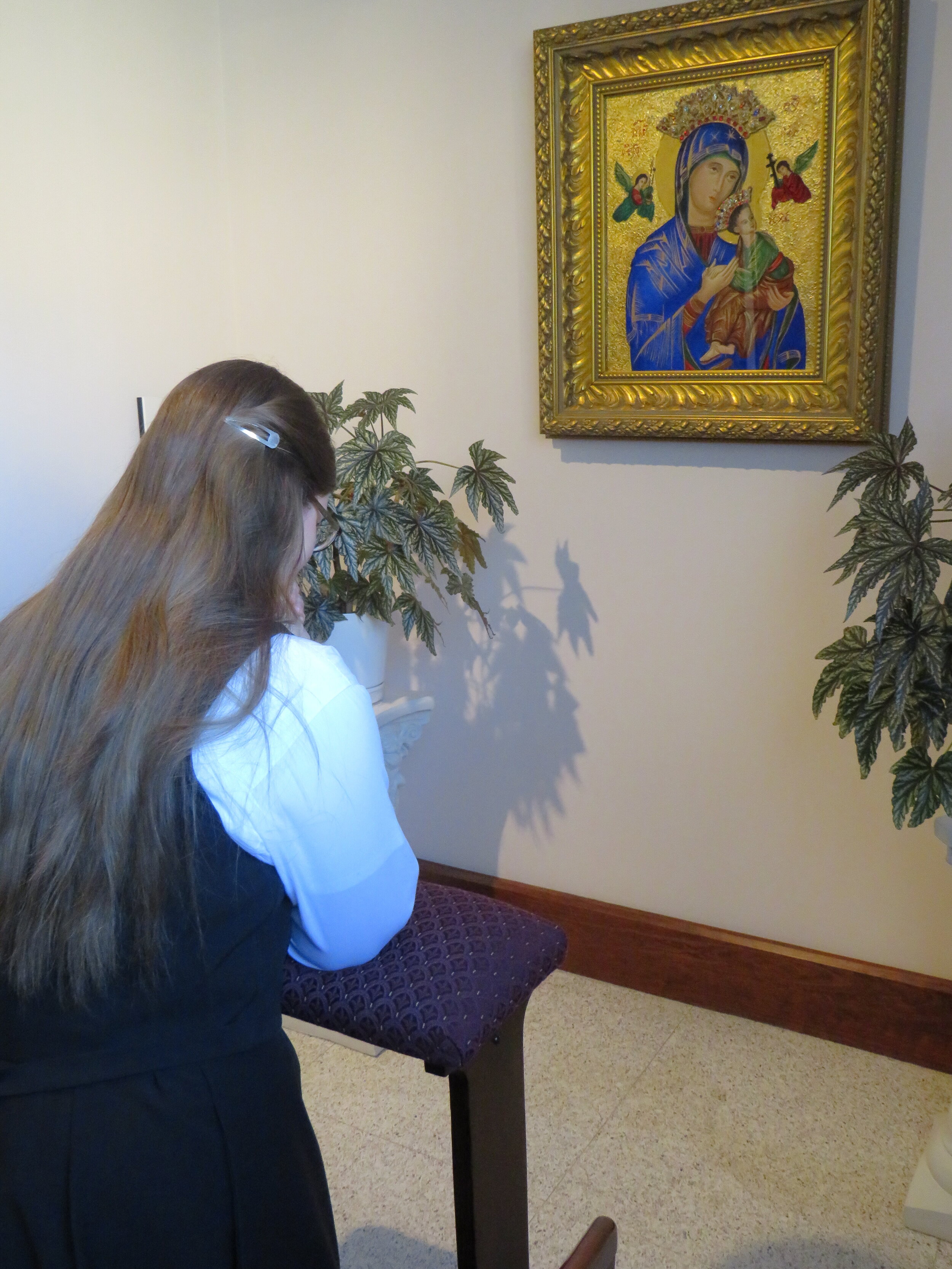  Postulant Theresa in prayer before the ceremony. 