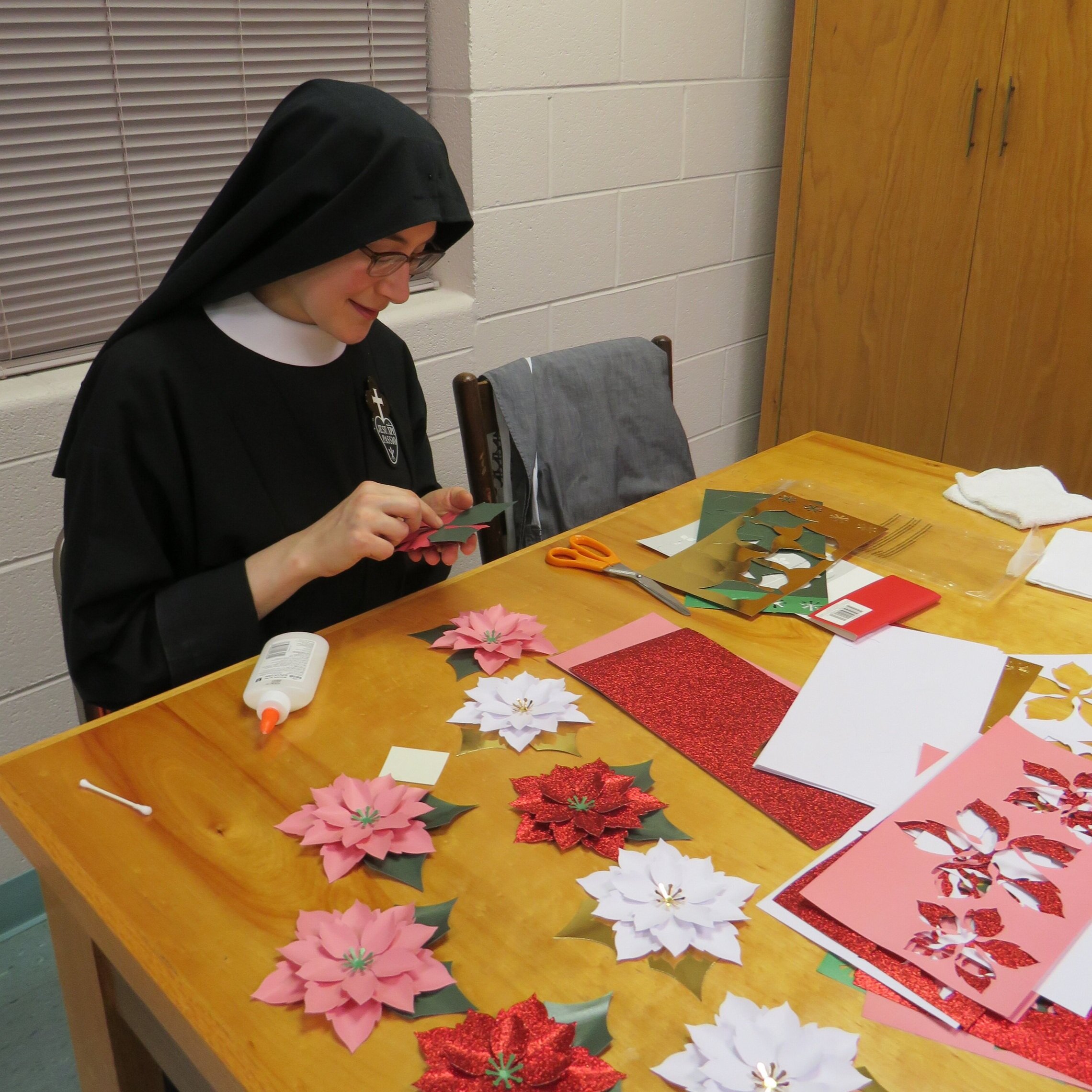  Sr. Lucia Marie (making paper poinsettia decorations) 