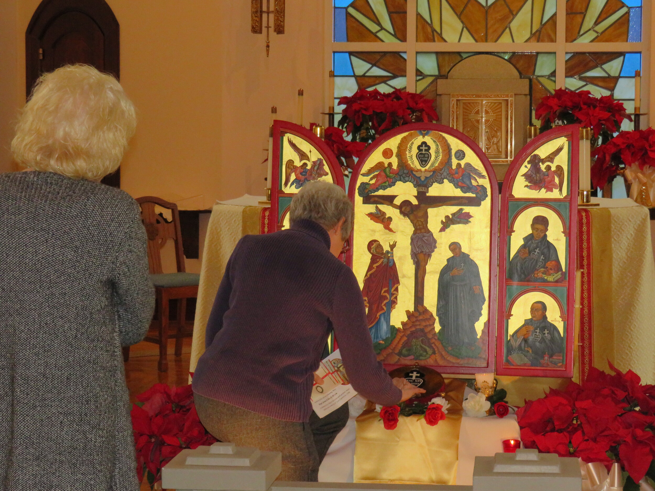  Oblate Joy Bach venerates the relic and icon. 