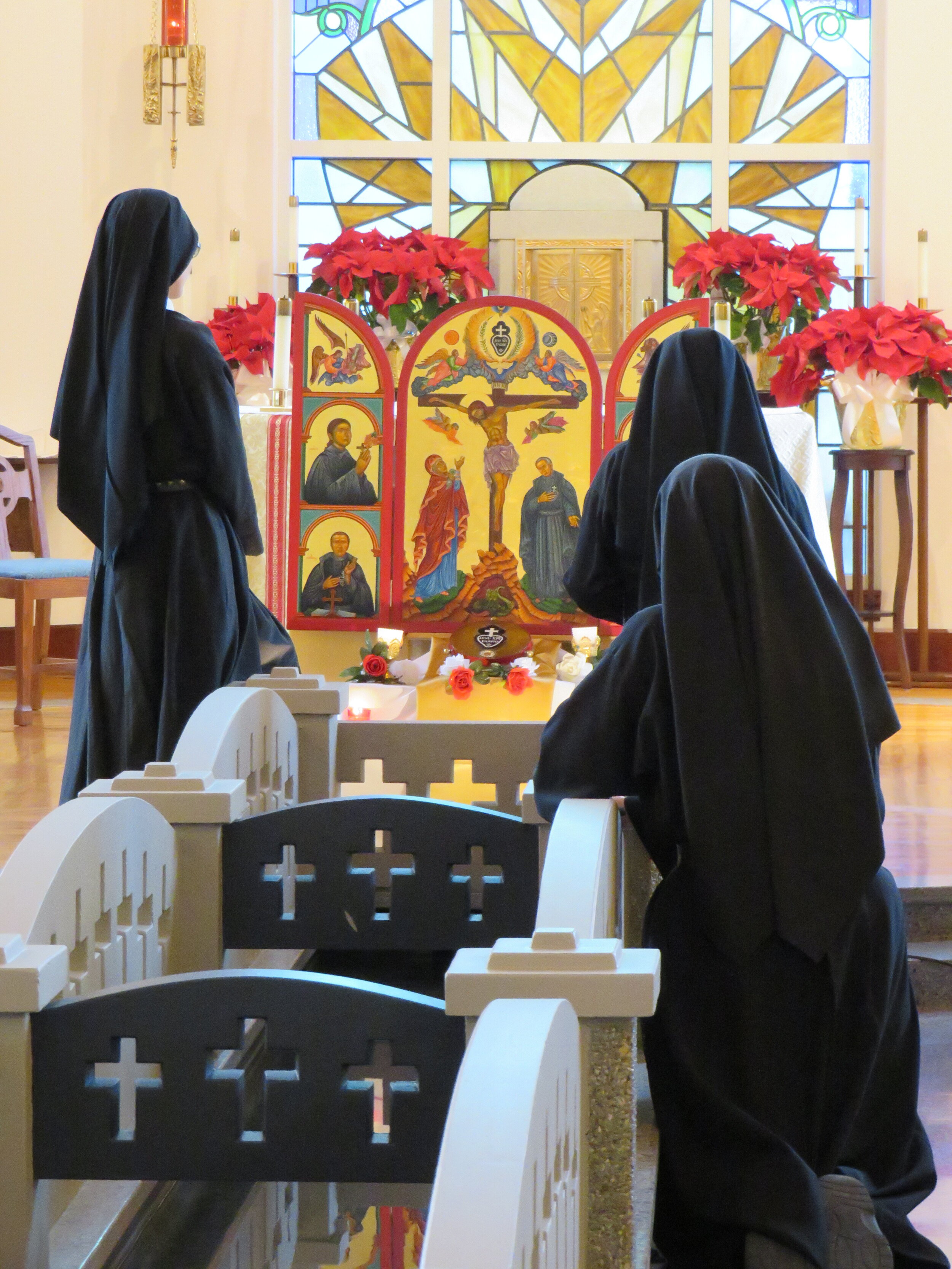  The nuns take time for prayer before the icon and their founder’s relic. 