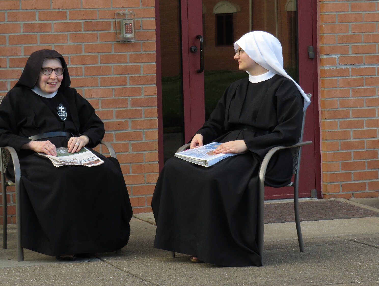  Sr. Mary Magdalen and Sr. Miriam Esther enjoy a conversation on the patio 