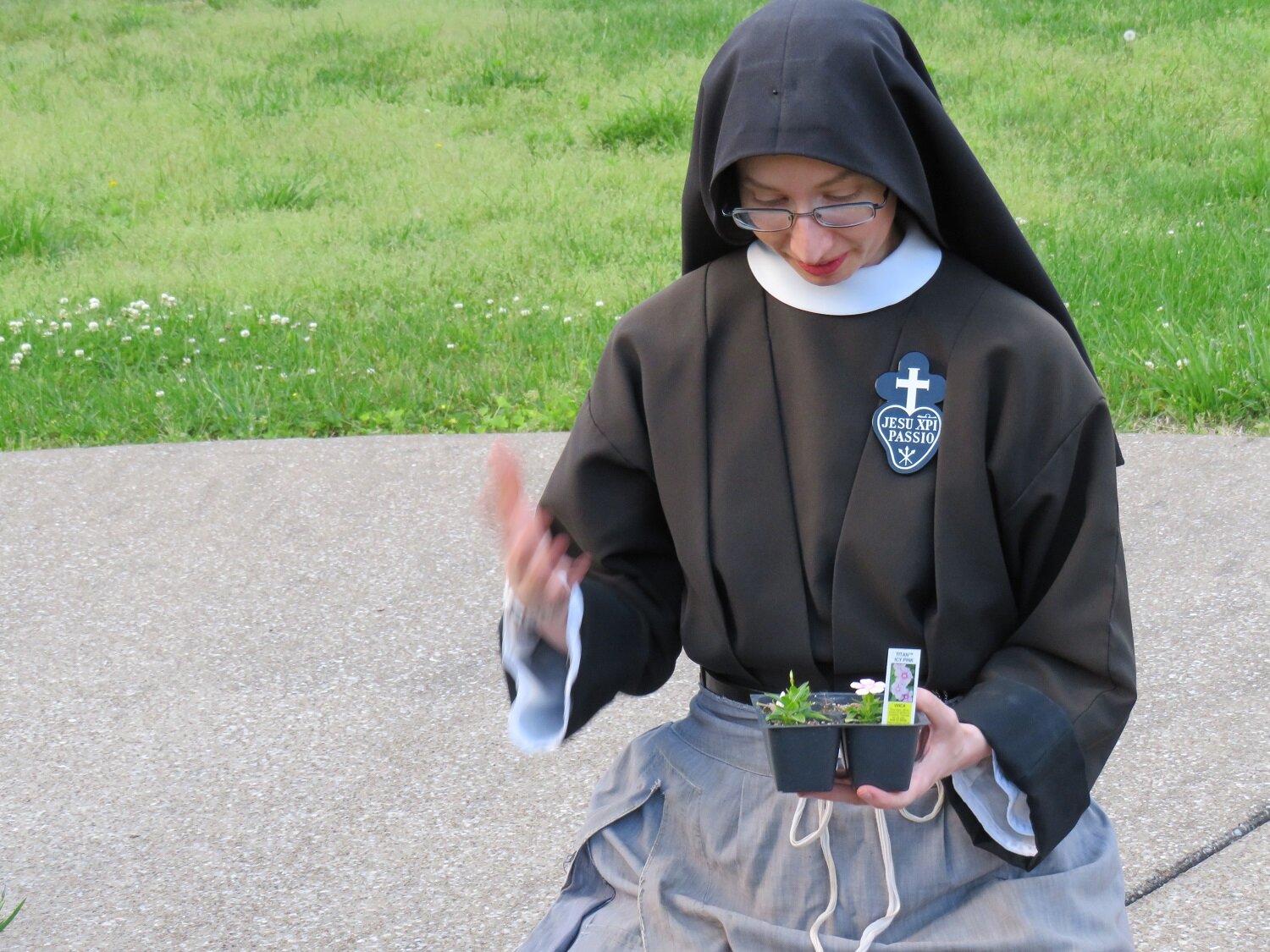  Sr. Cecilia Maria exhorts her new flowers to grow big and strong! 
