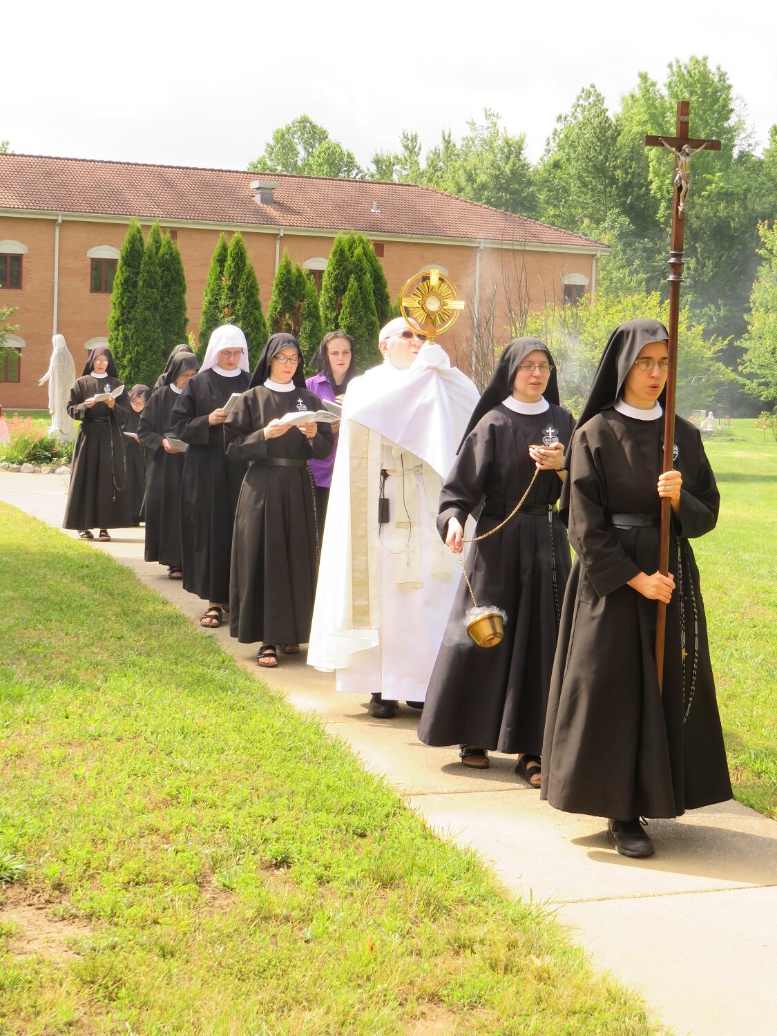  The procession passes through our cloistered courtyard 