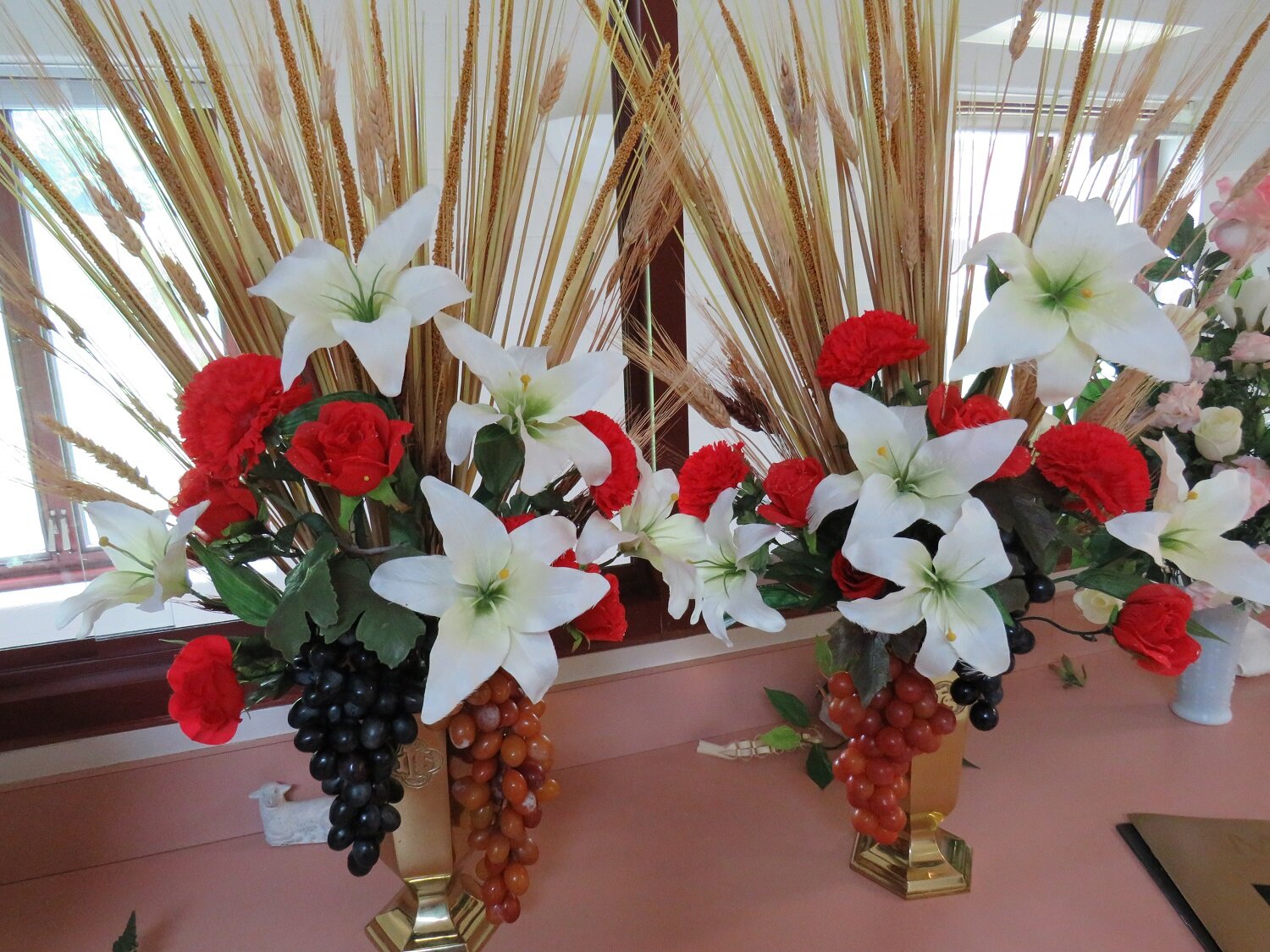  For Corpus Christi, Sister creatively incorporated wheat and grapes into these bouquets! 
