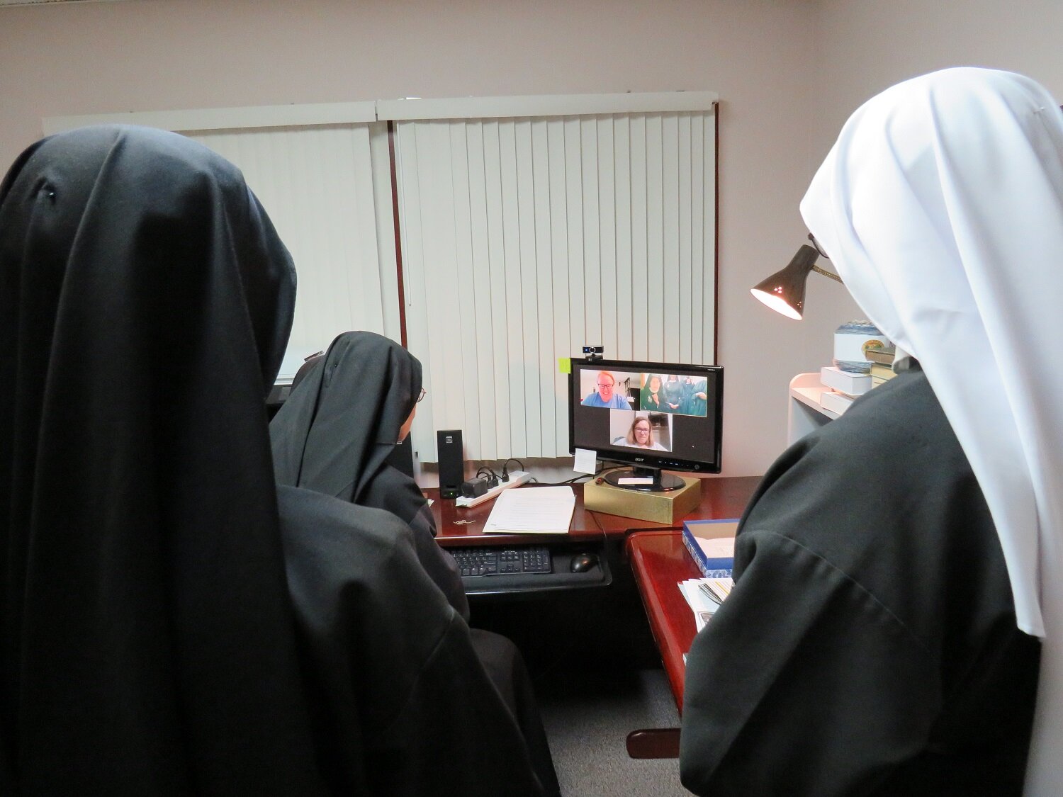  A group of Sisters gathered for recreation “with” the discerners 