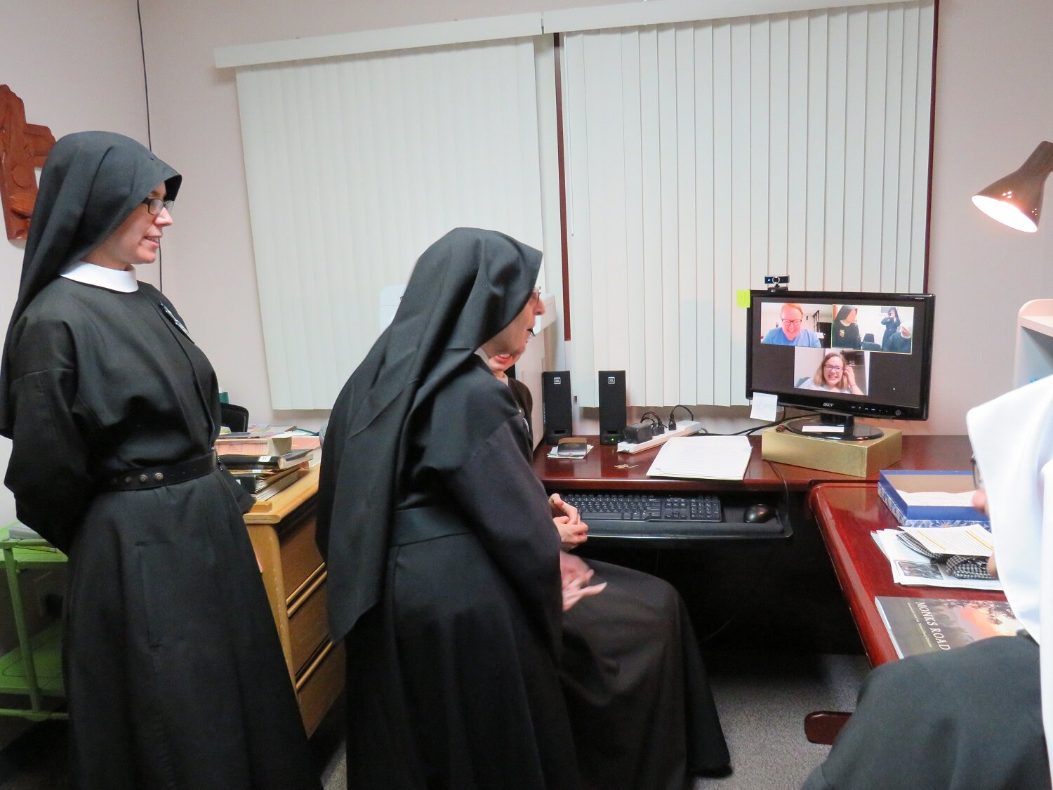  Sister Mary Elizabeth (center) stops in to greet the young women on retreat 