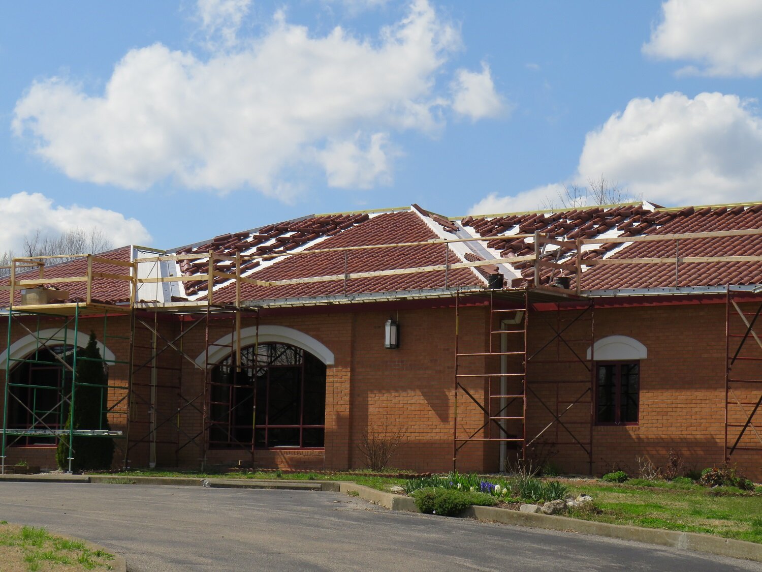 March 24 - retreat house roof is almost complete, and the red fascia is installed 