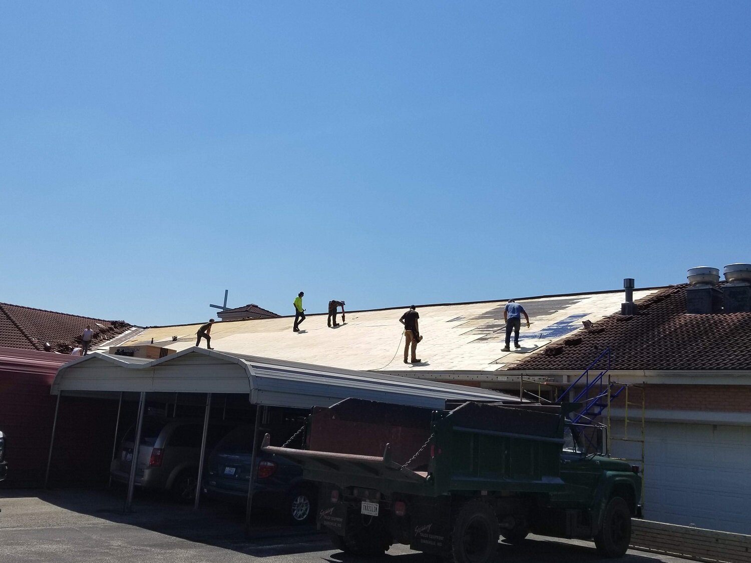 June 9 - work has begun on our work wing roof