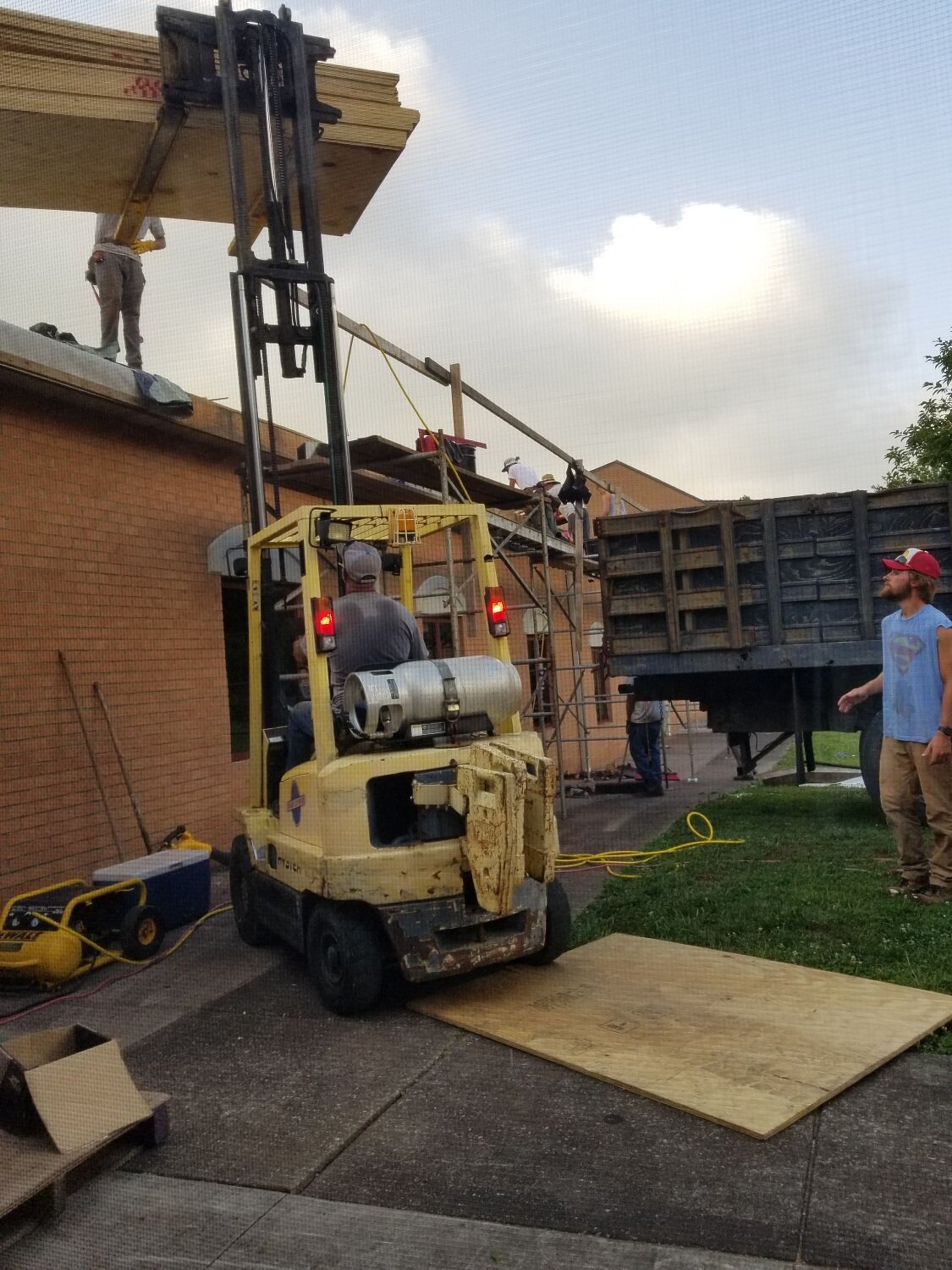  The Helmings crew are certainly handy with a forklift and can be seen whizzing around the property with loads of plywood, tile, and underlayment! 