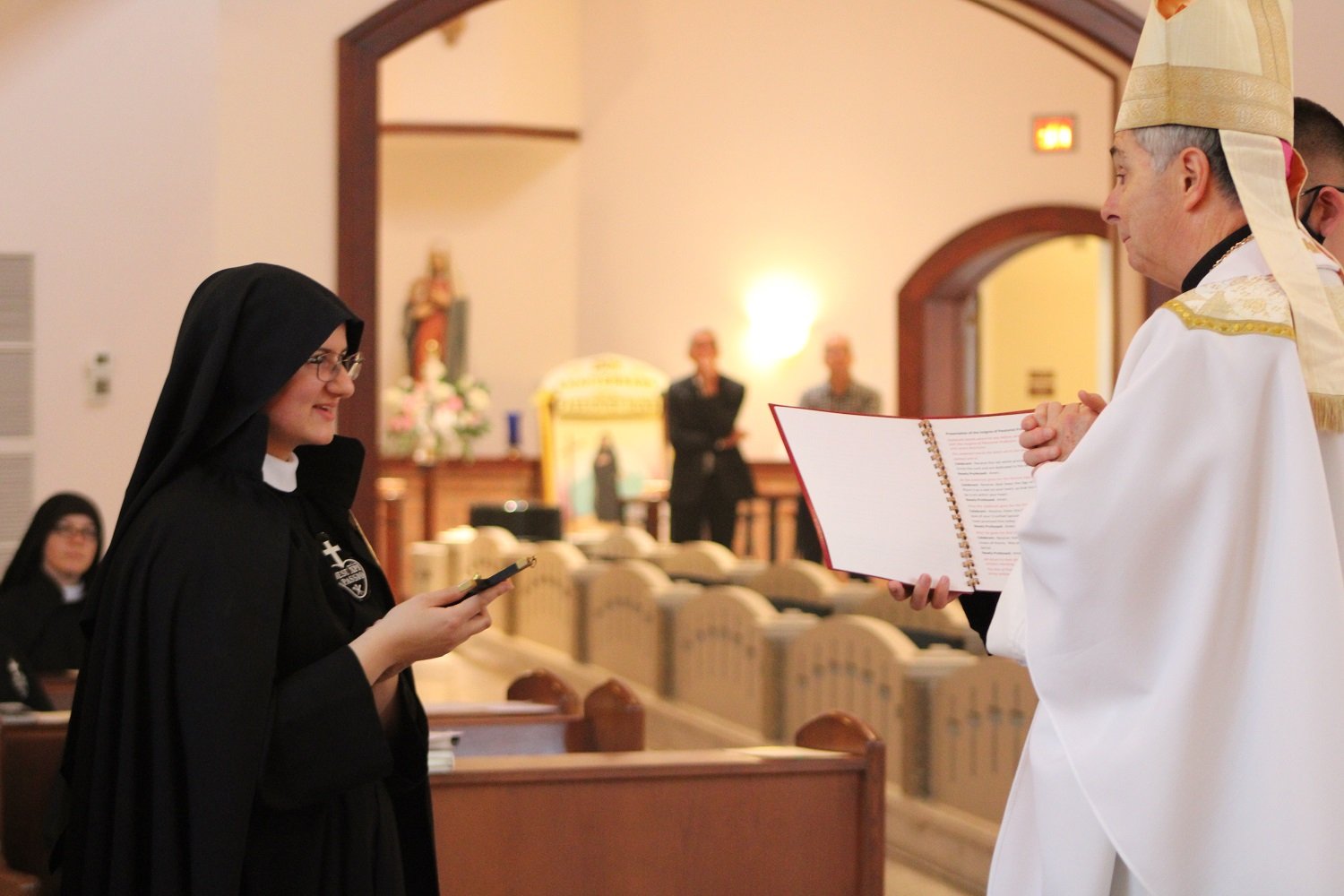  Receiving the Profession Crucifix from Bishop Medley 