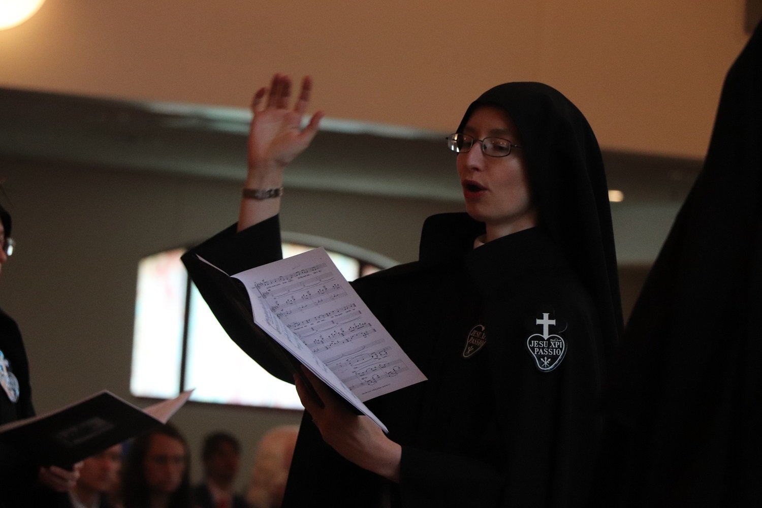  Sr. Cecilia Maria conducts the monastic choir as they sing the beautiful hymn “View Me, Lord, A Work of Thine” 
